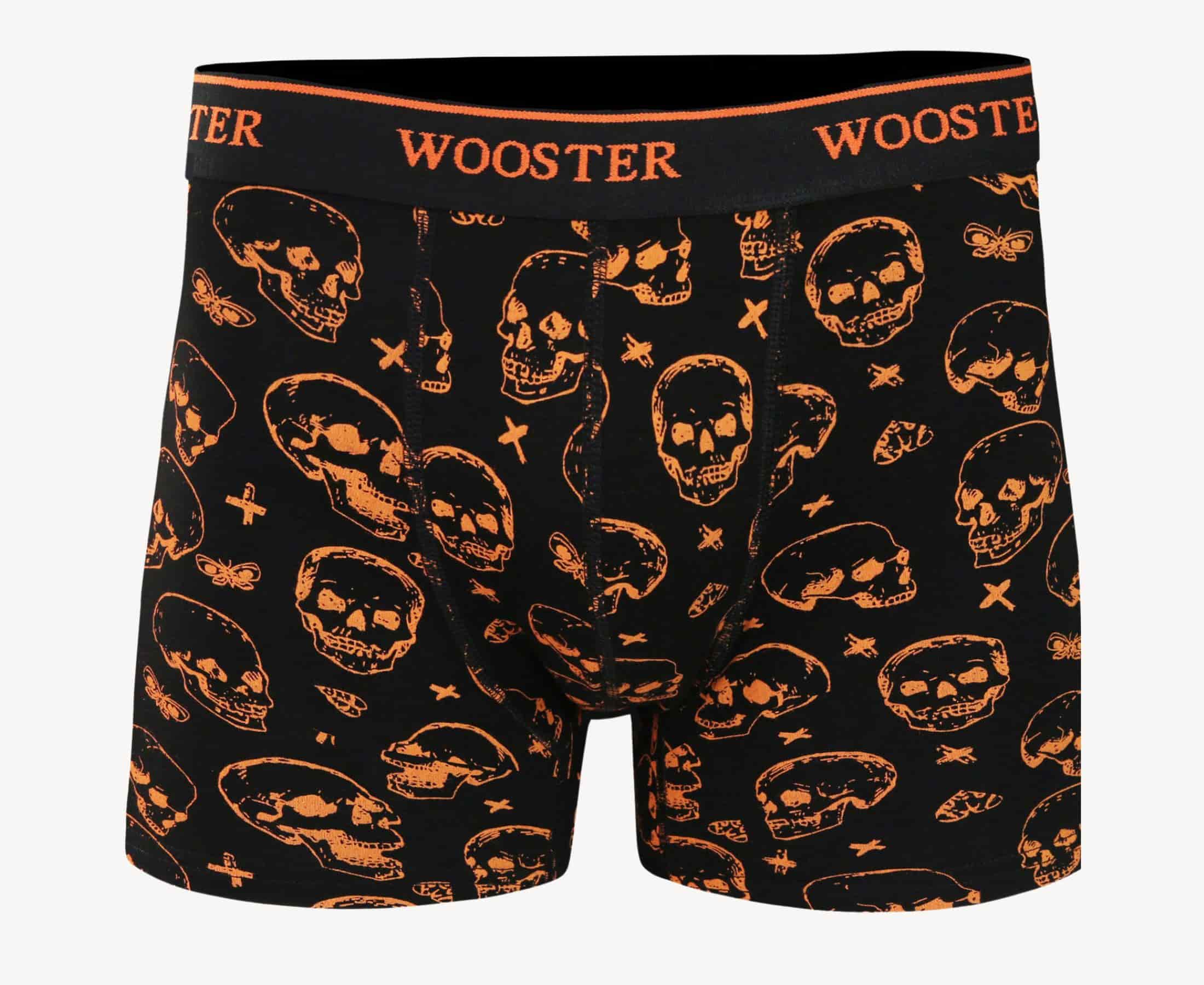 Front view of men’s 95% cotton black boxer brief with orange skulls print, relaxed fit, soft stretch cotton, and no-roll waistband