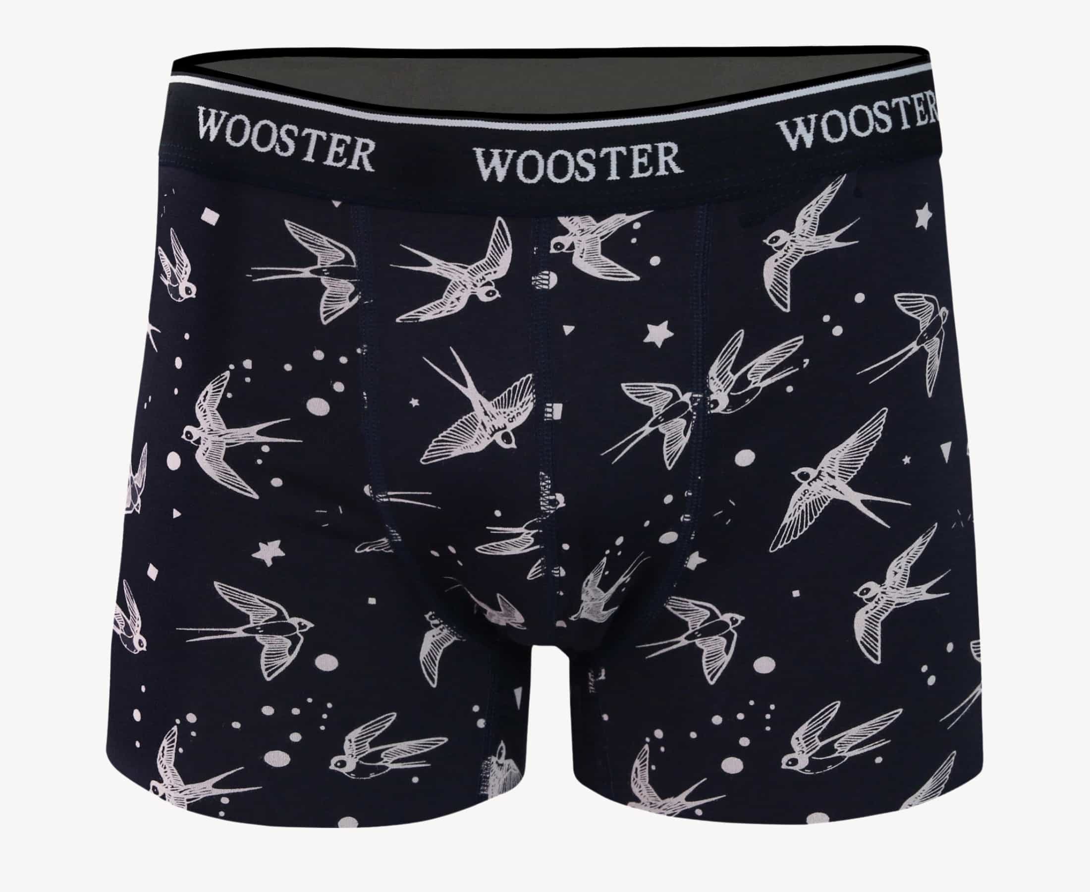 Front view of men’s 95% cotton navy boxer brief with light pink starling birds, stars, and moon print, relaxed fit, soft stretch cotton, and no-roll waistband