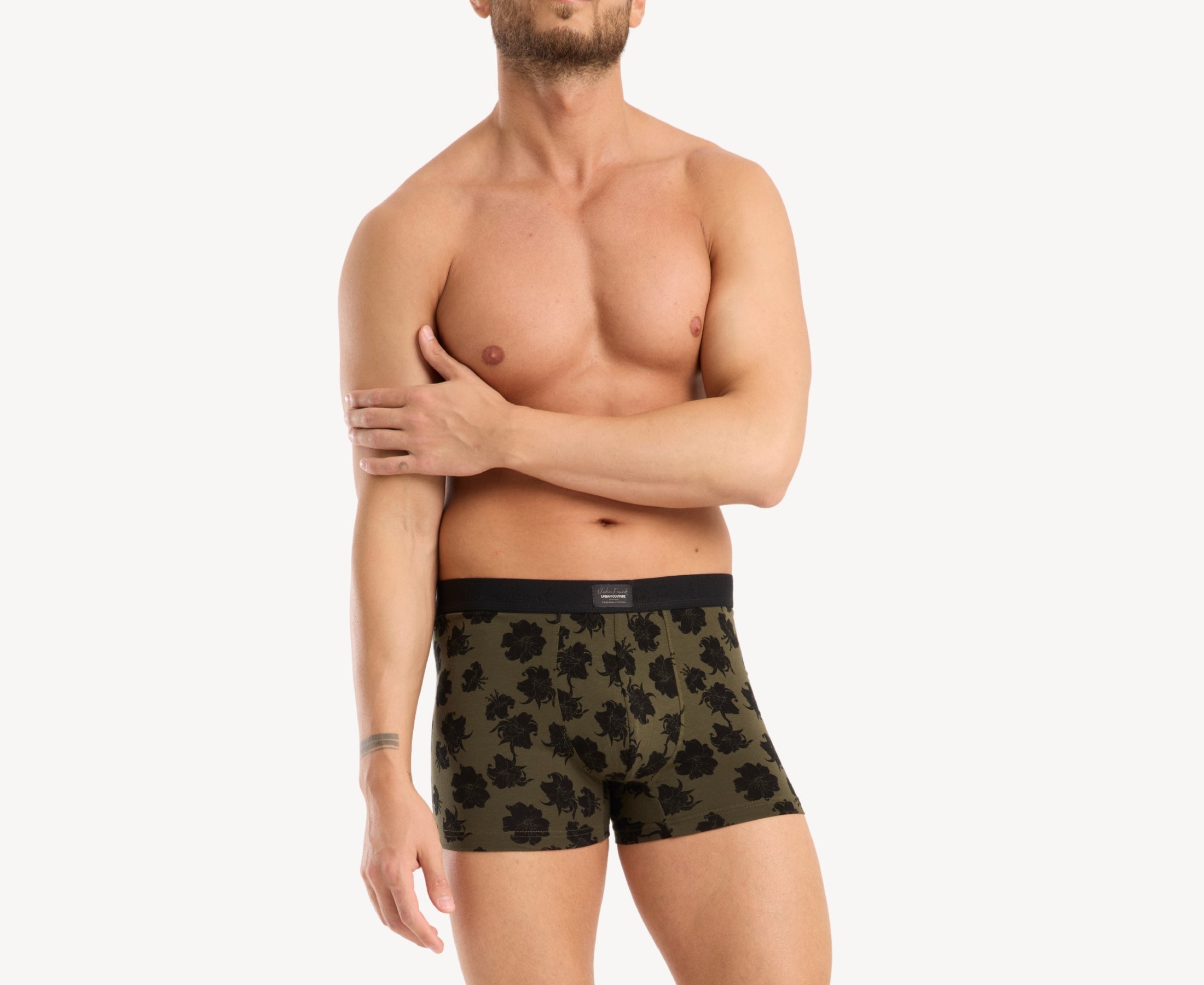 Front view of male model wearing men’s 95% cotton boxer brief in olive with black hibiscus print, no-roll waistband, and soft stretch