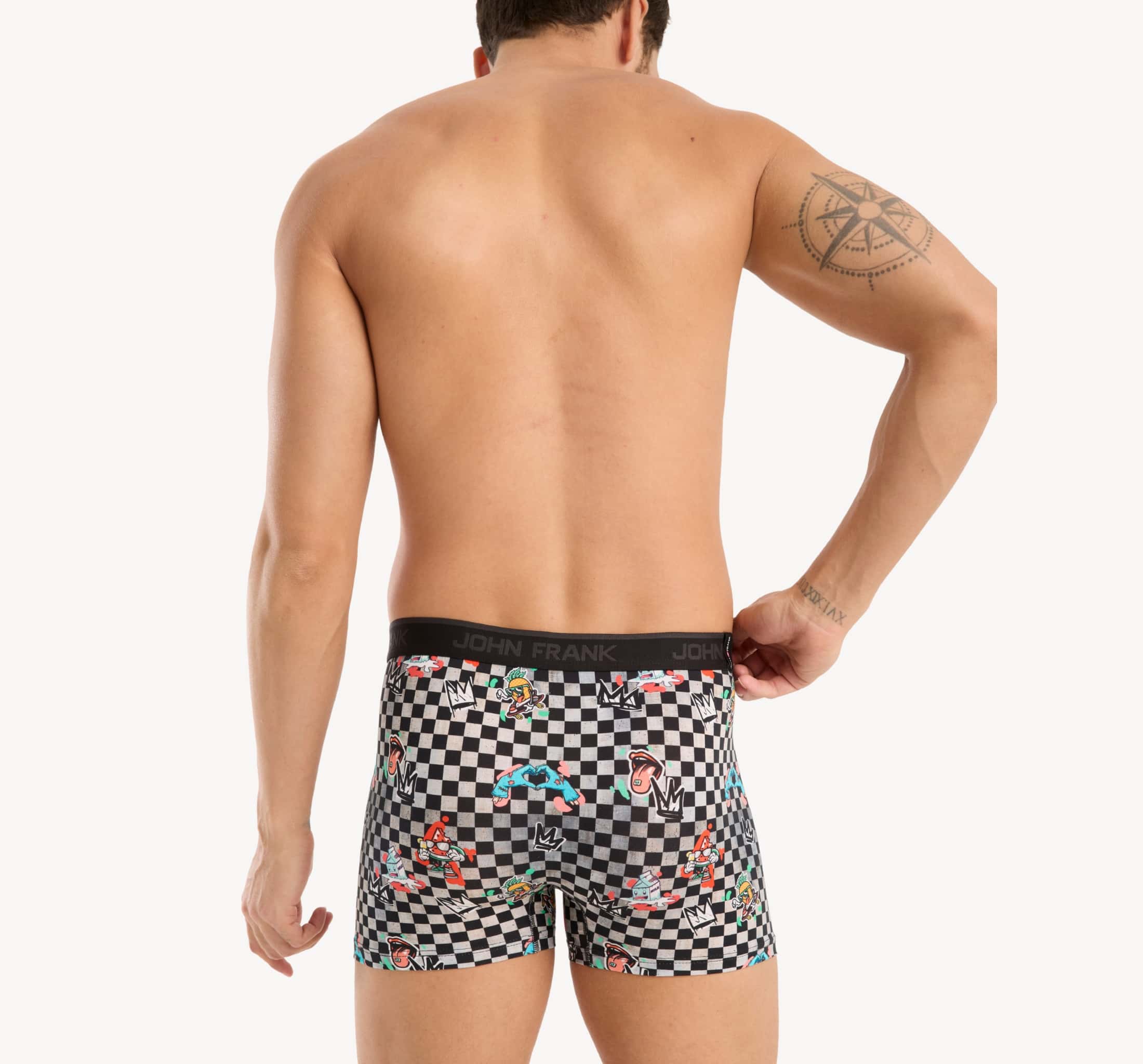 Back view of model wearing men’s 95% cotton boxer brief in checkered surrealist print with smooth waistband and rear detail