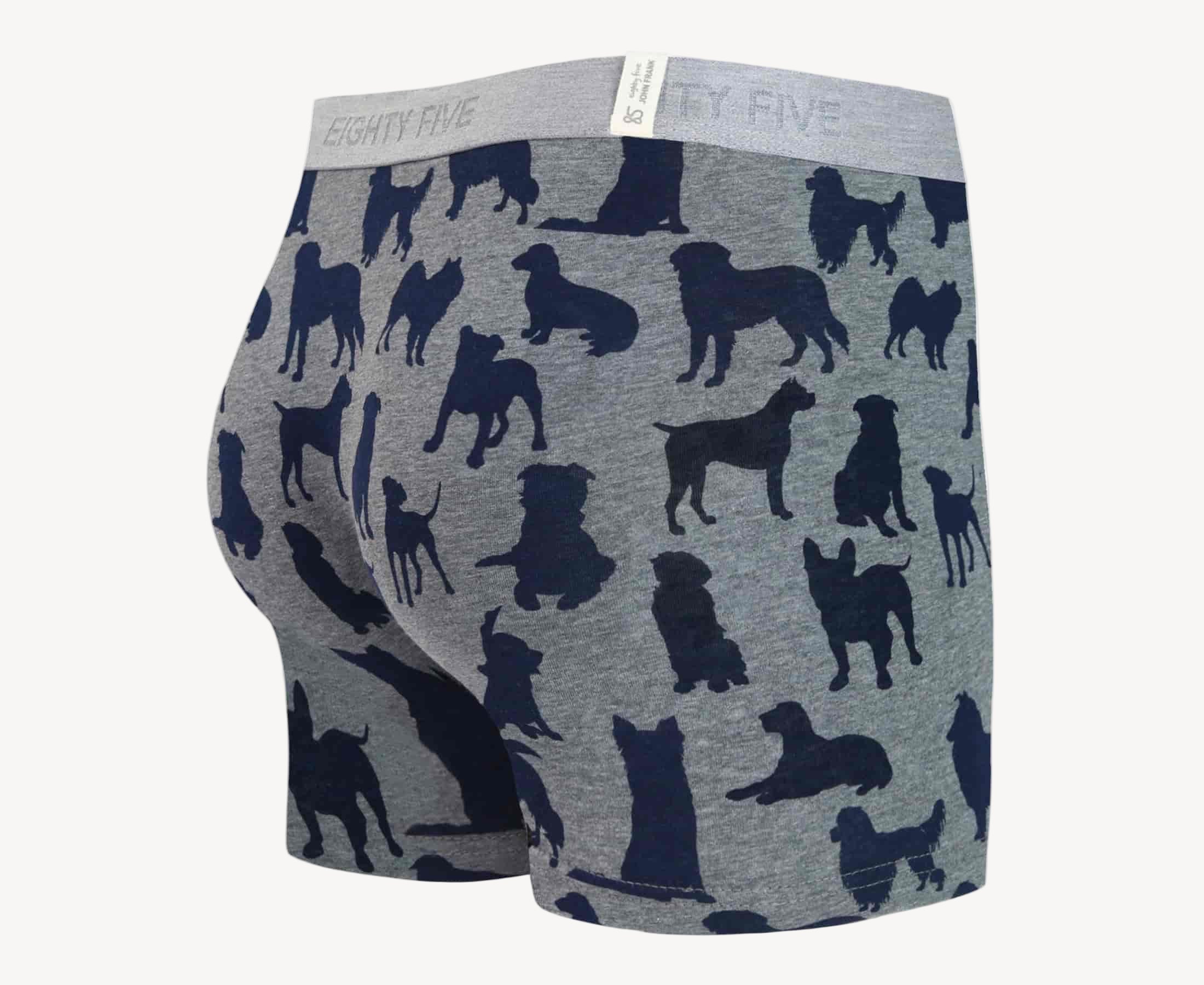 Back view of men’s 95% cotton boxer brief in gray with navy dog print, smooth waistband, and rear detail