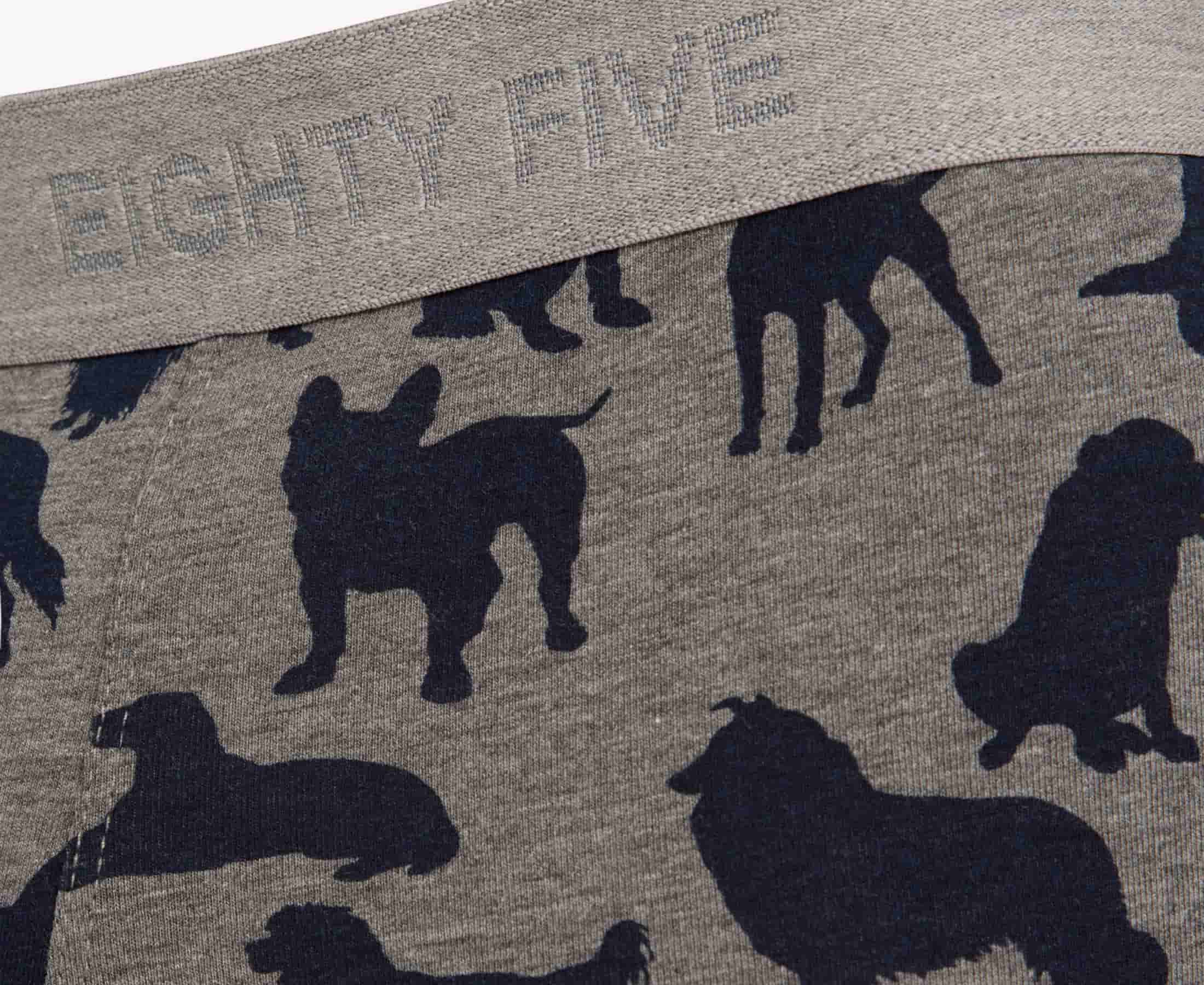 Gray fabric with navy dog silhouettes of various breeds and 'EIGHTY FIVE' branding on thegray waistband