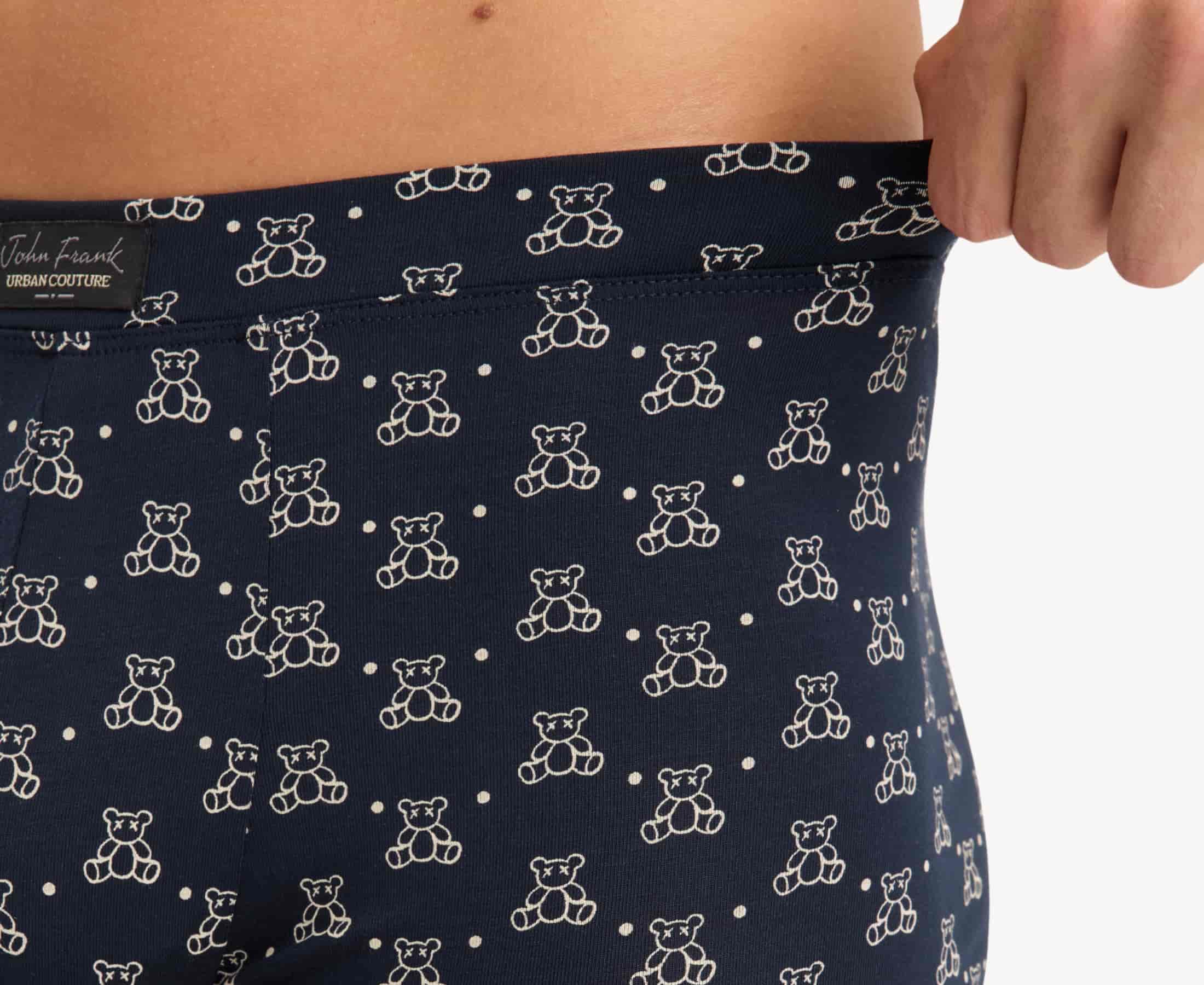 Close-up view of men’s 95% micromodal boxer brief in navy with teddy bear print, showcasing soft stretch and fabric detail