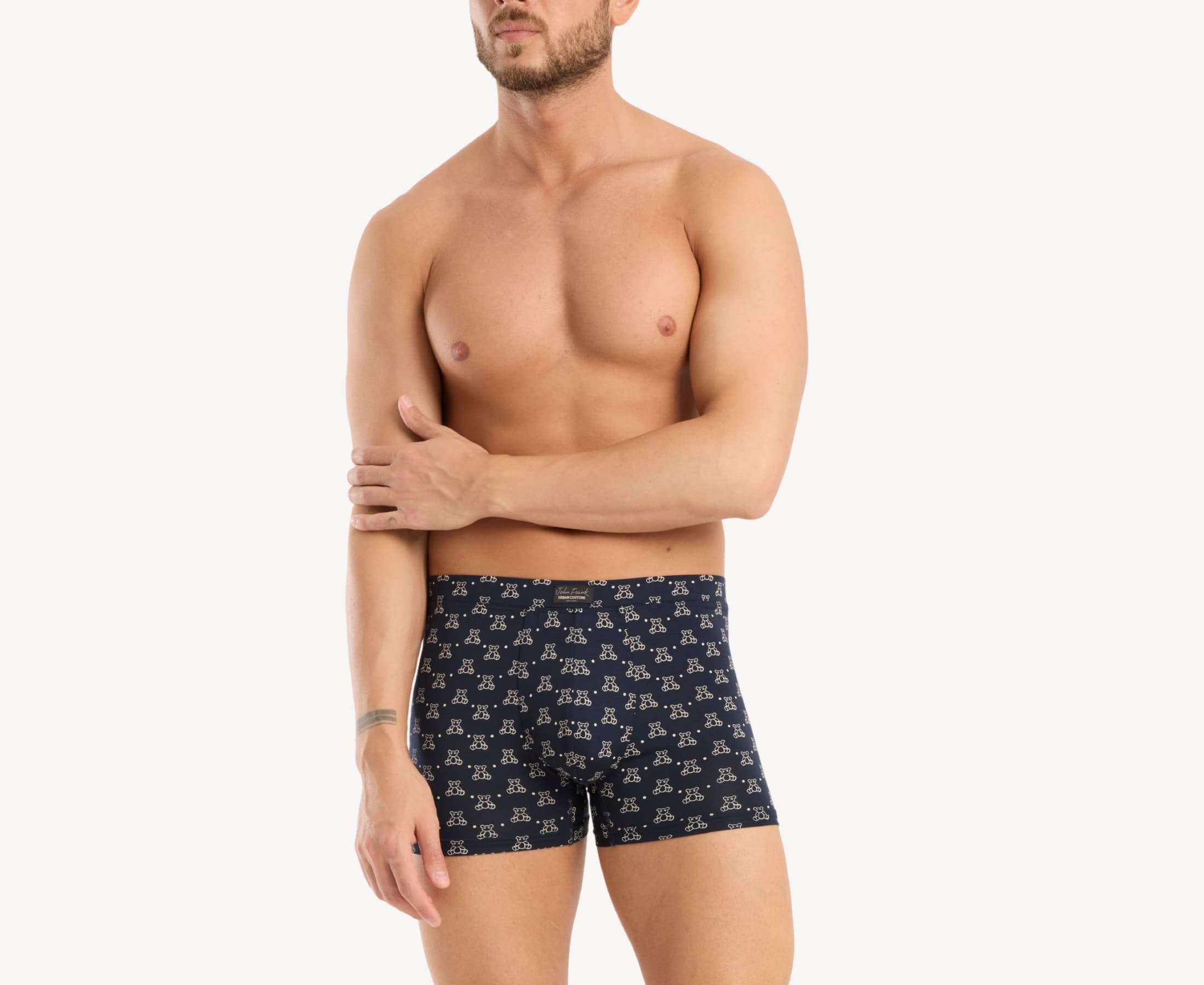 Front view of model wearing men’s 95% micromodal boxer brief in navy with teddy bear print, soft stretch and fabric-covered waistband