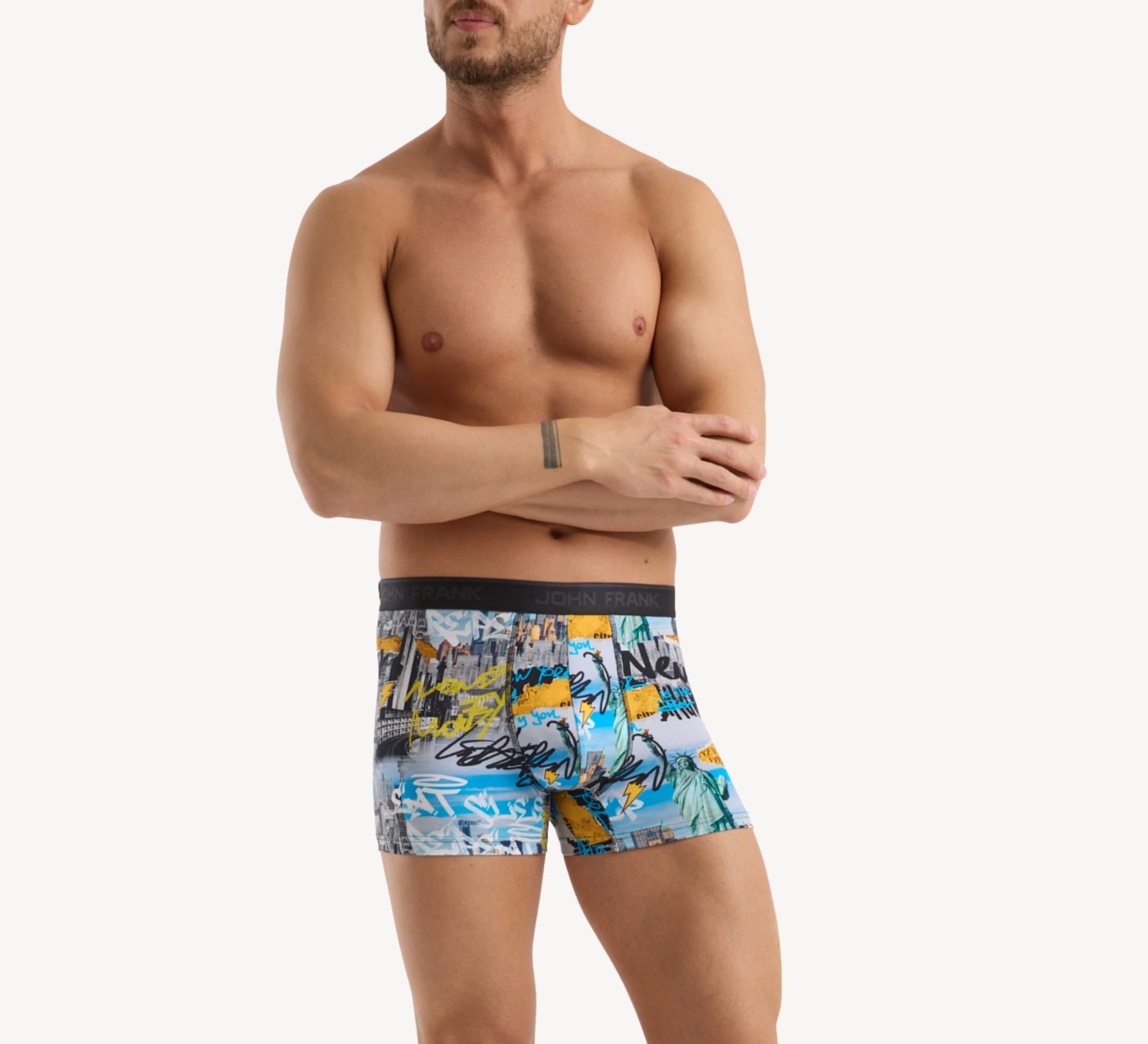 Front view of model wearing men’s 95% cotton boxer brief in multicolor NYC-inspired print with soft stretch and no-roll waistband