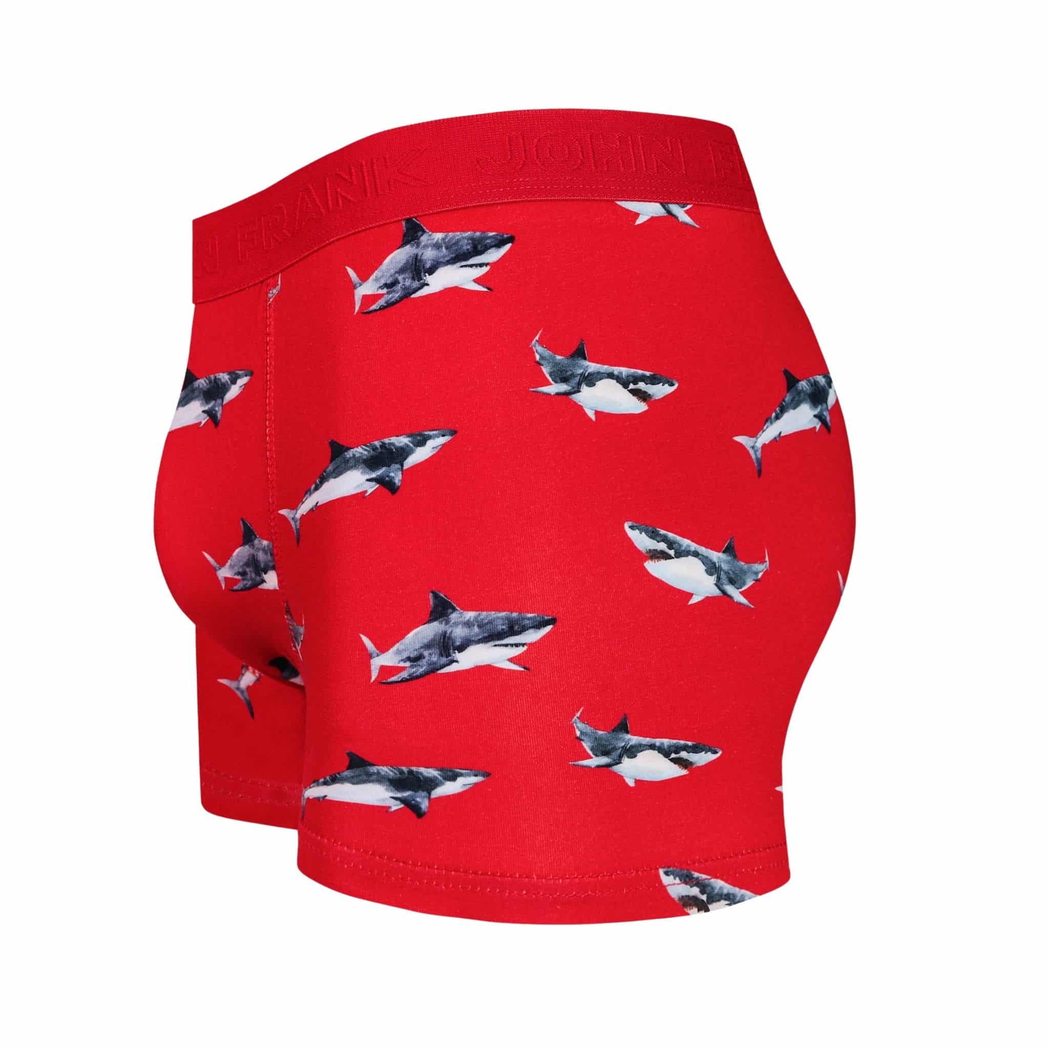 Side view of men’s 95% cotton boxer brief in coral with shark print, contoured pouch, and tailored leg cut