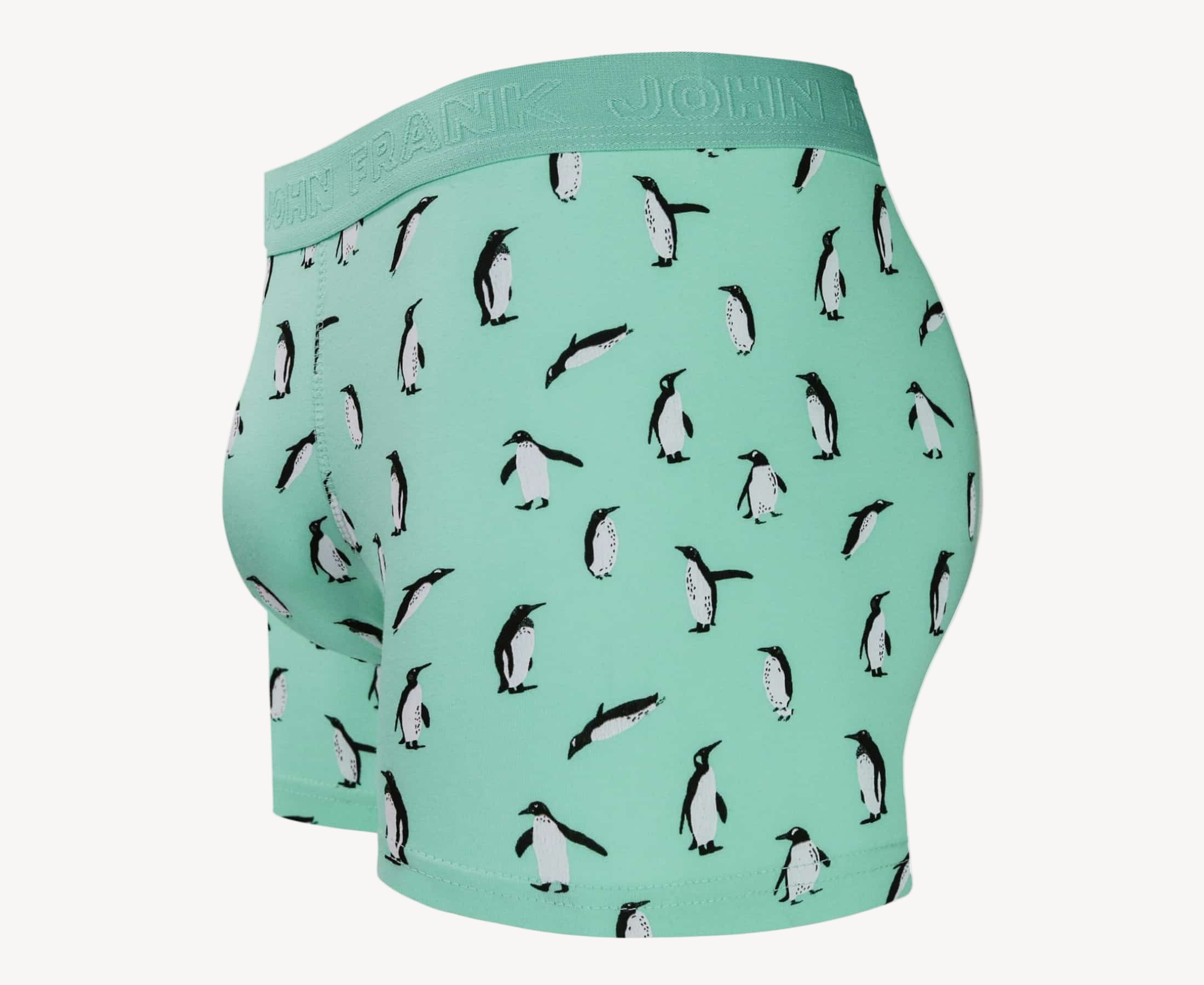 Side view of men’s 95% cotton boxer brief in turquoise with penguin print, contoured pouch, and tailored leg cut