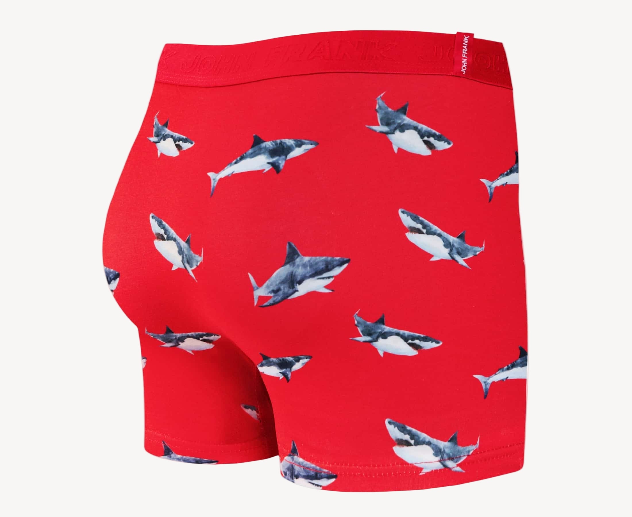 Back view of men’s 95% cotton boxer brief in coral with shark print, smooth waistband, and rear detail