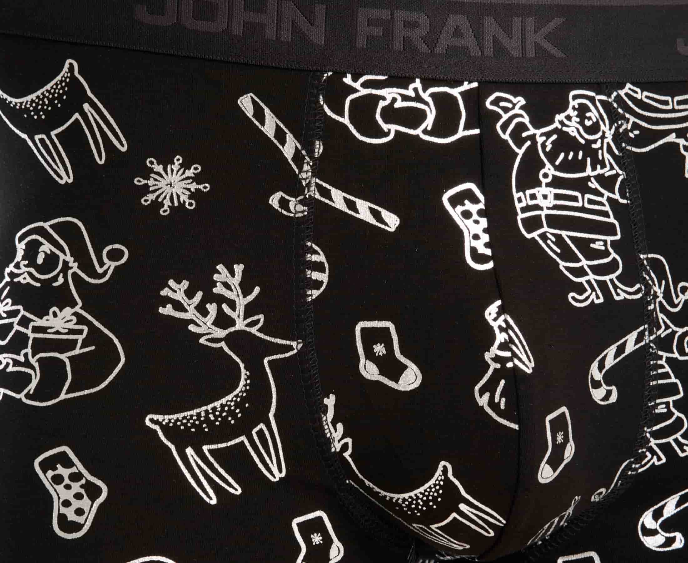 Black fabric detail with shiny silver doodles of Santa Claus, reindeers, candy canes and snowflakes