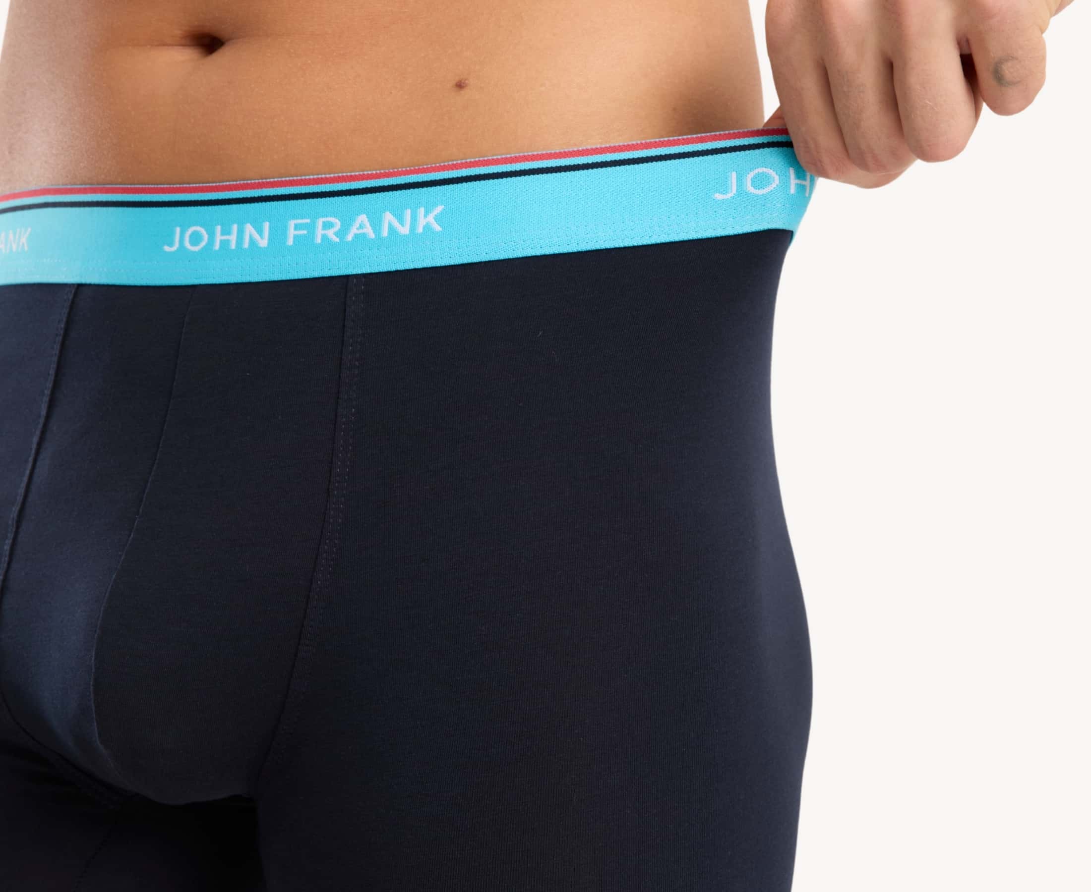Close-up view of men’s 95% cotton boxer brief in midnight blue with turquoise striped waistband , showcasing waistband detail