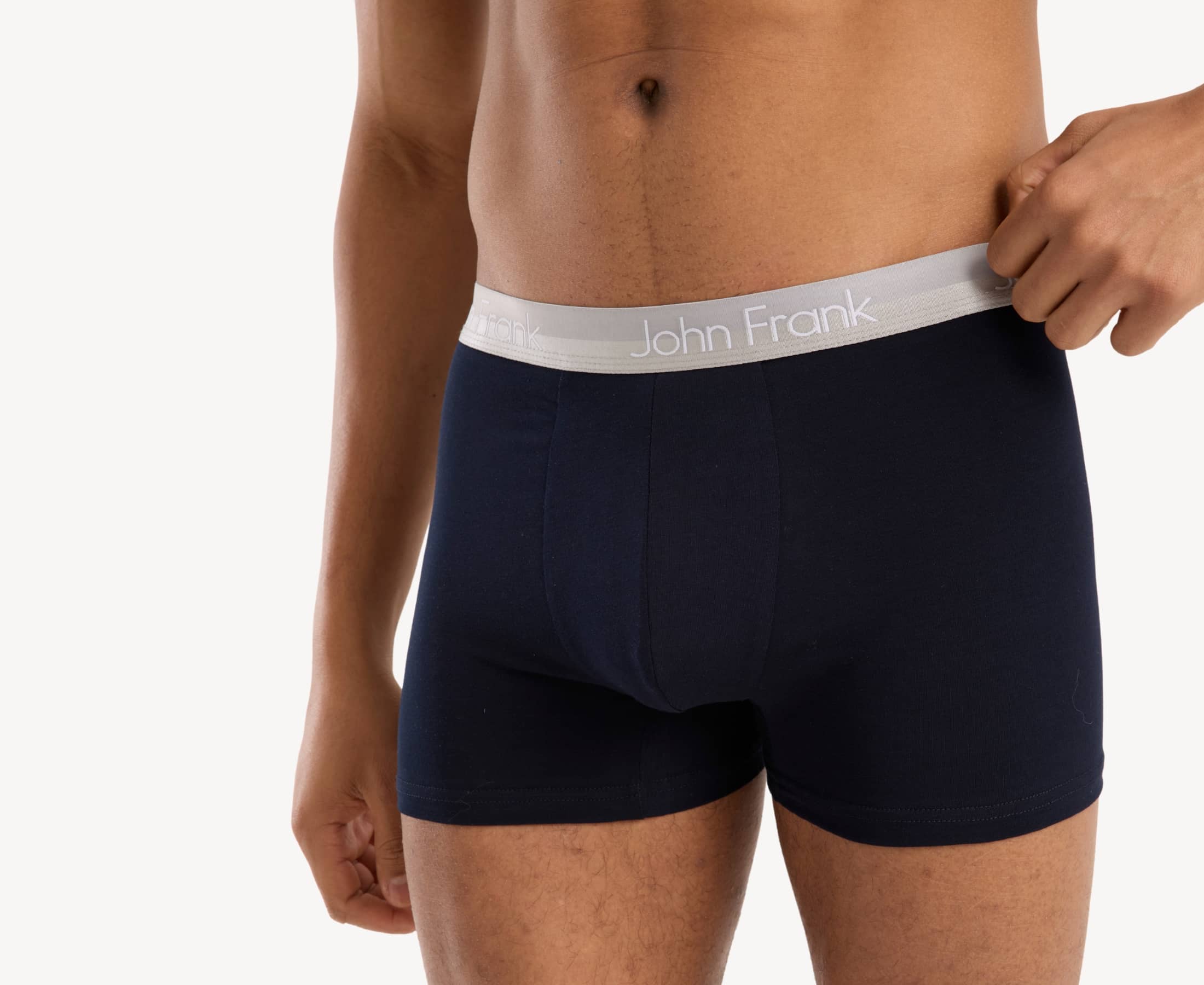 Waistband detail of men’s 95% cotton boxer brief in navy with white shiny waistband