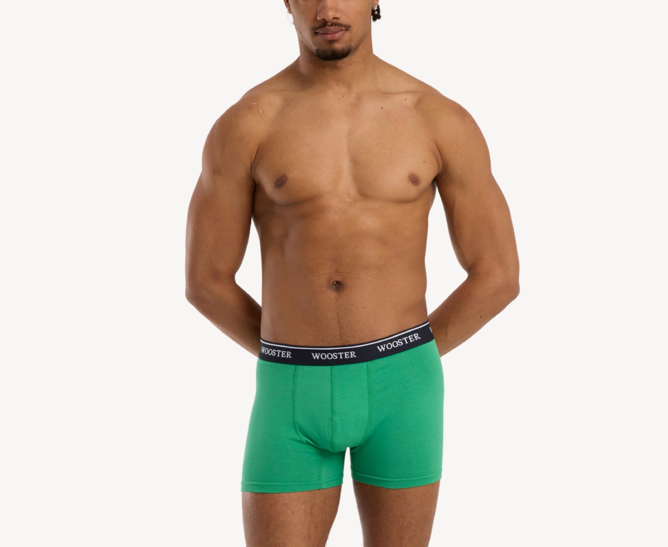 Front view of model wearing men’s 95% cotton boxer brief in meadow green with relaxed fit, soft stretch cotton, and no-roll waistband
