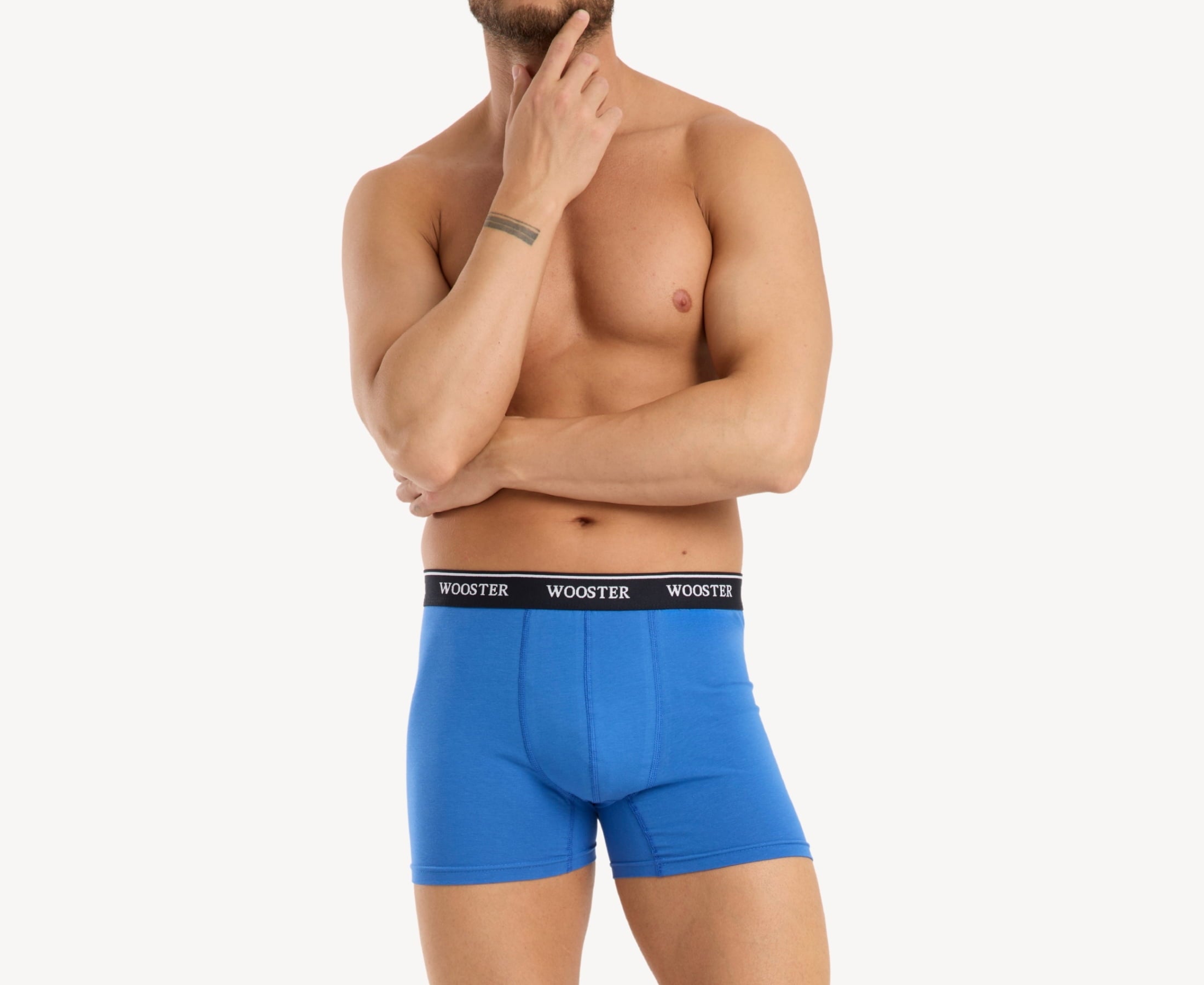 Front view of model wearing men’s 95% cotton boxer brief in sky blue with relaxed fit, soft stretch cotton, and no-roll waistband