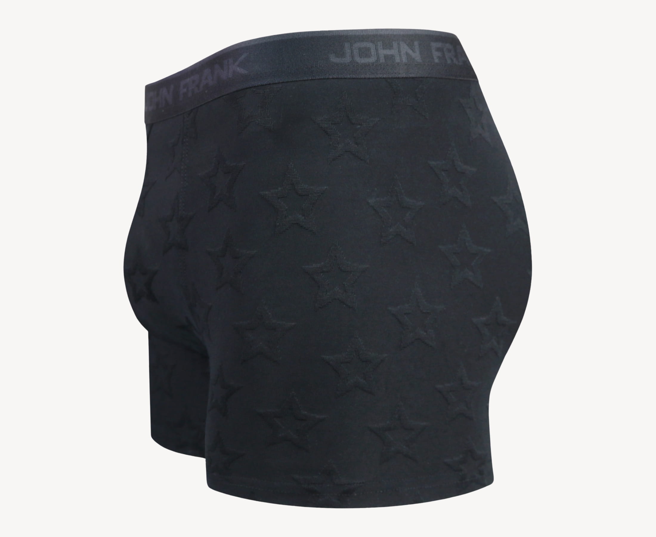 Side view of men’s 95% micromodal boxer brief in black with jacquard stars pattern, showcasing contoured pouch, and tailored leg cut