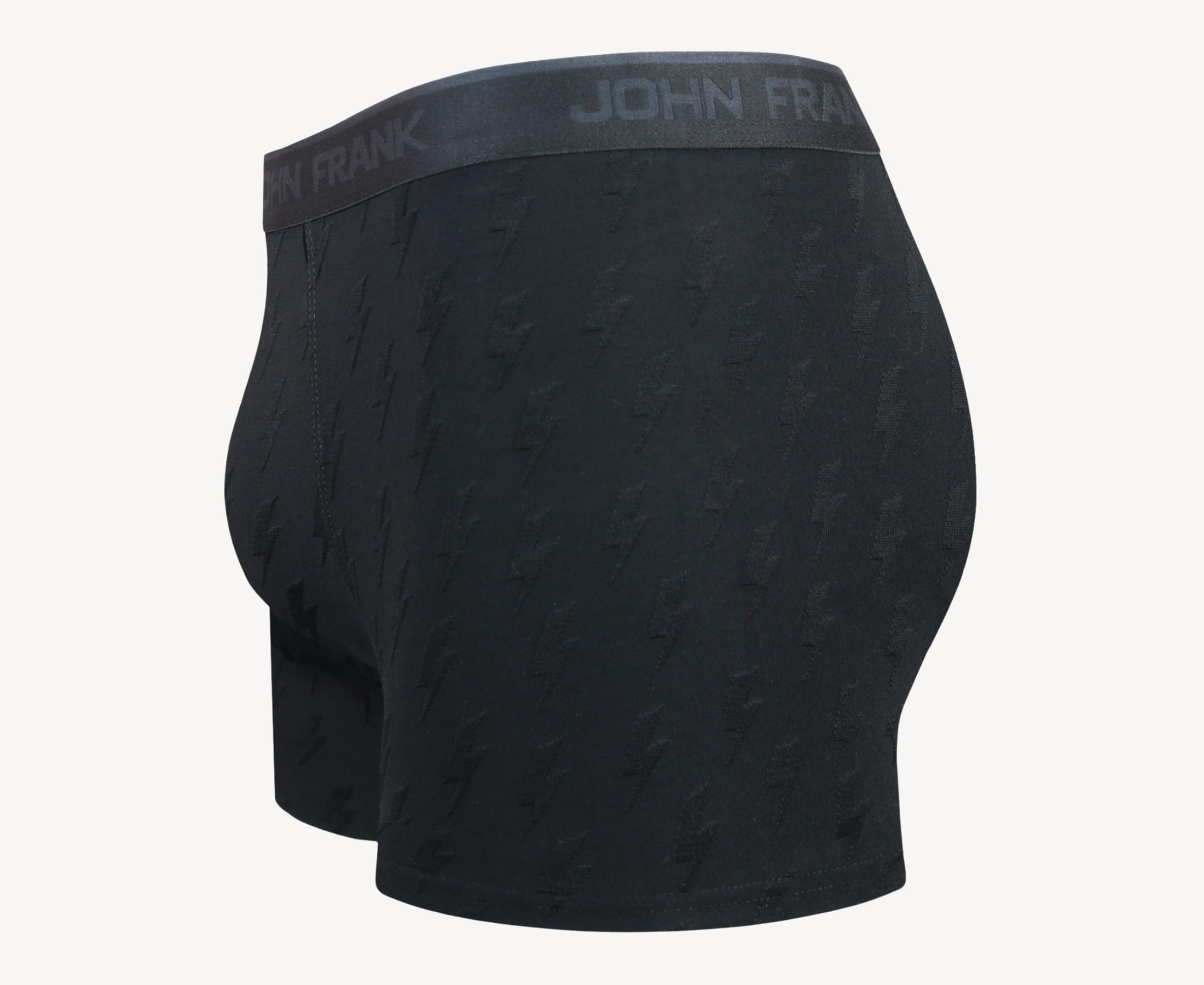 Side view of men’s 95% micromodal boxer brief in black with jacquard lightening flash pattern, showcasing contoured pouch, and tailored leg cut