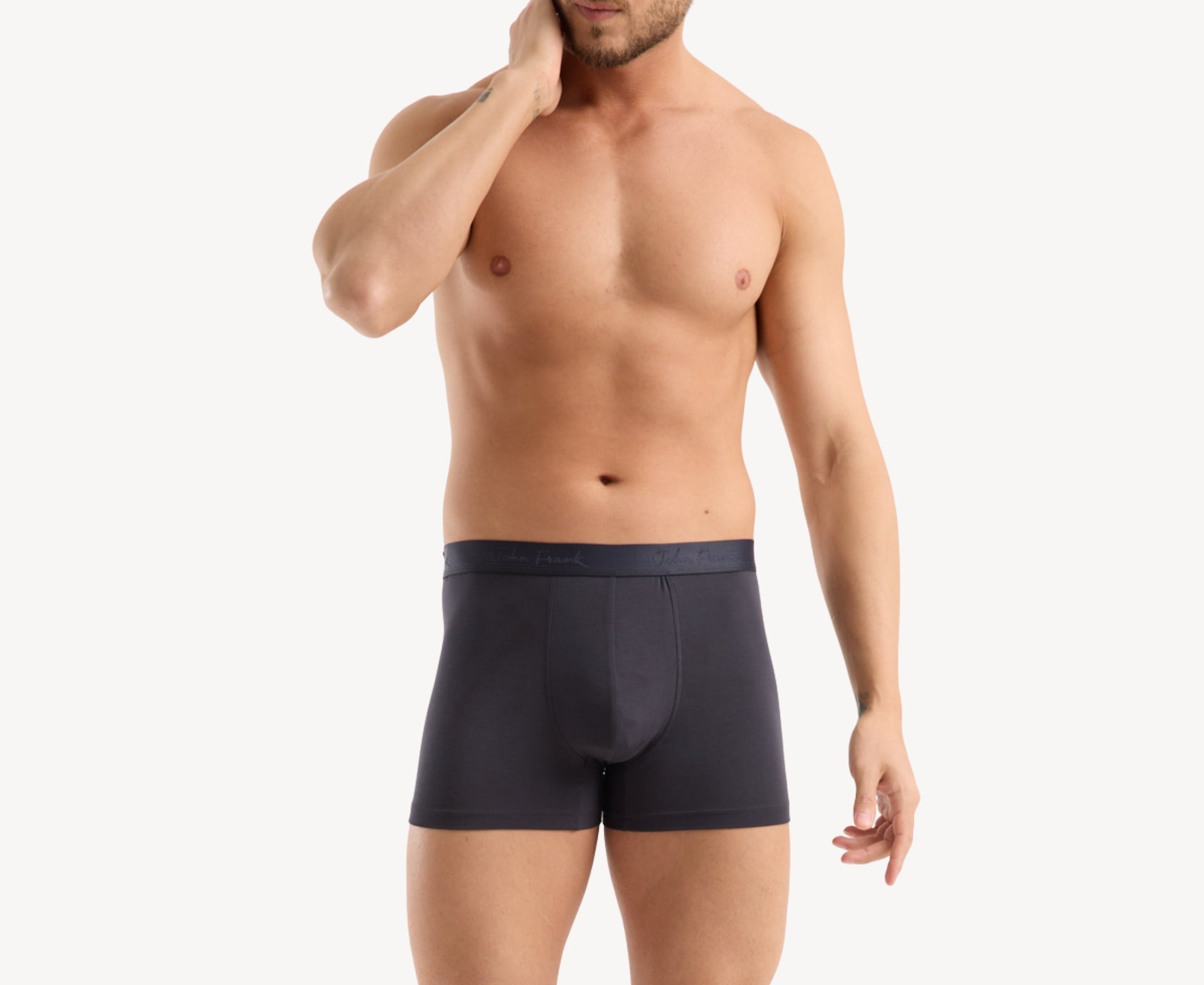 Front view of model wearing men’s 95% micromodal boxer brief in anthracite with tonal waistband featuring subtle sheen, and soft stretch