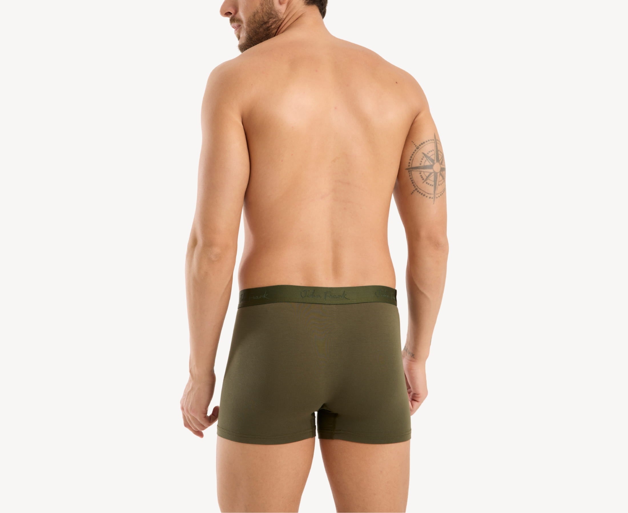Back view of model wearing men’s 95% micromodal boxer brief in olive with tonal waistband featuring subtle sheen and clean rear detail