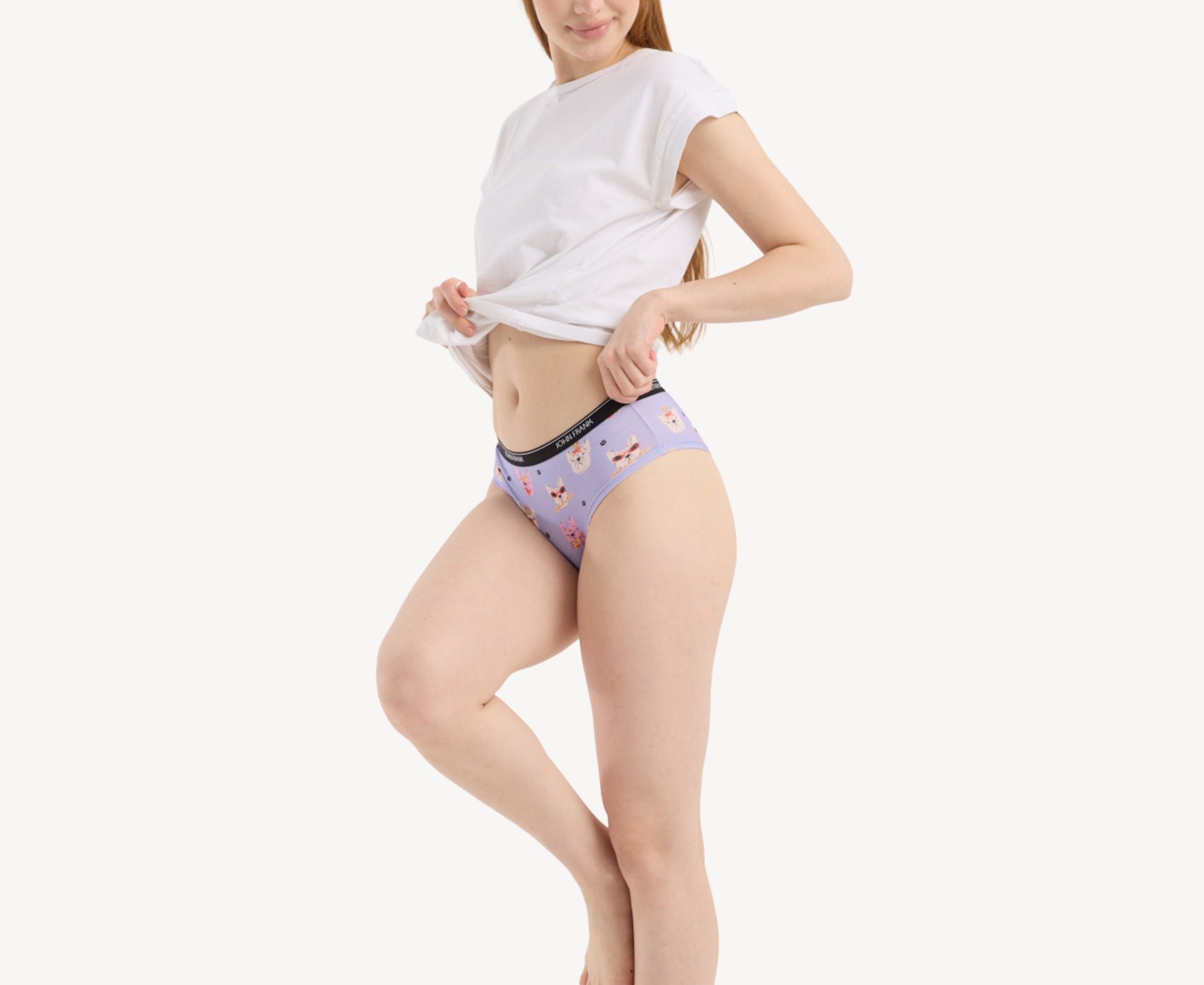Side view of model wearing women’s 95% premium cotton hipster in lavender with fun French bulldog print, showcasing mid-rise cut and smooth waistband.