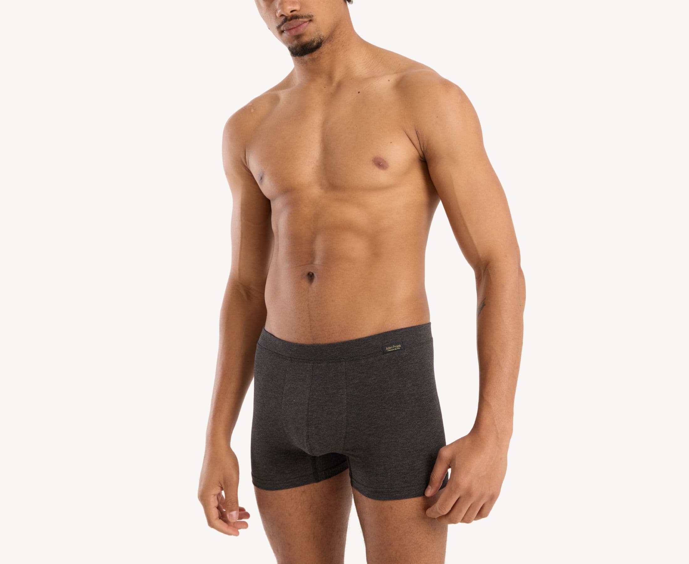 Side view of model wearing men’s 95% cotton boxer brief in slate gray with fabric-covered waistband, contoured pouch, and tailored leg cut