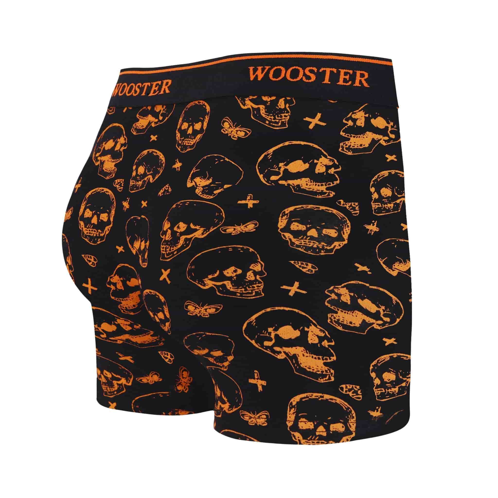 Back view of men’s 95% cotton black boxer brief with orange skulls print, relaxed fit, vibrant colors, and smooth rear panel