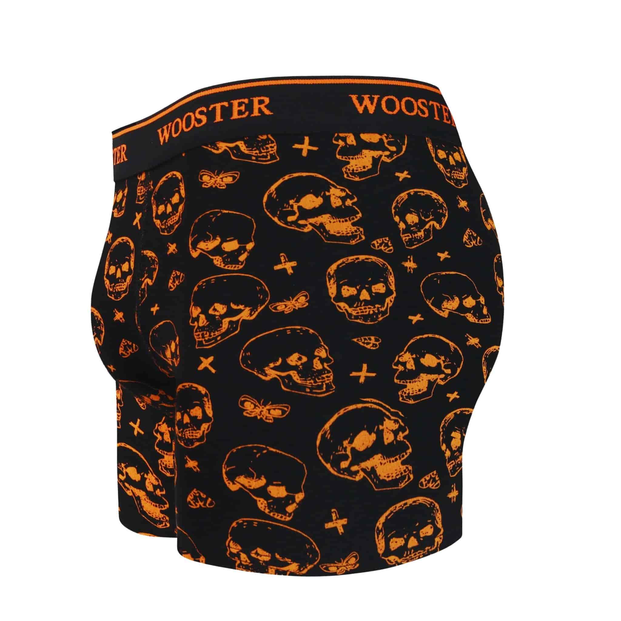 Side view of men’s 95% cotton black boxer brief with orange skulls print showing contoured pouch and relaxed fit