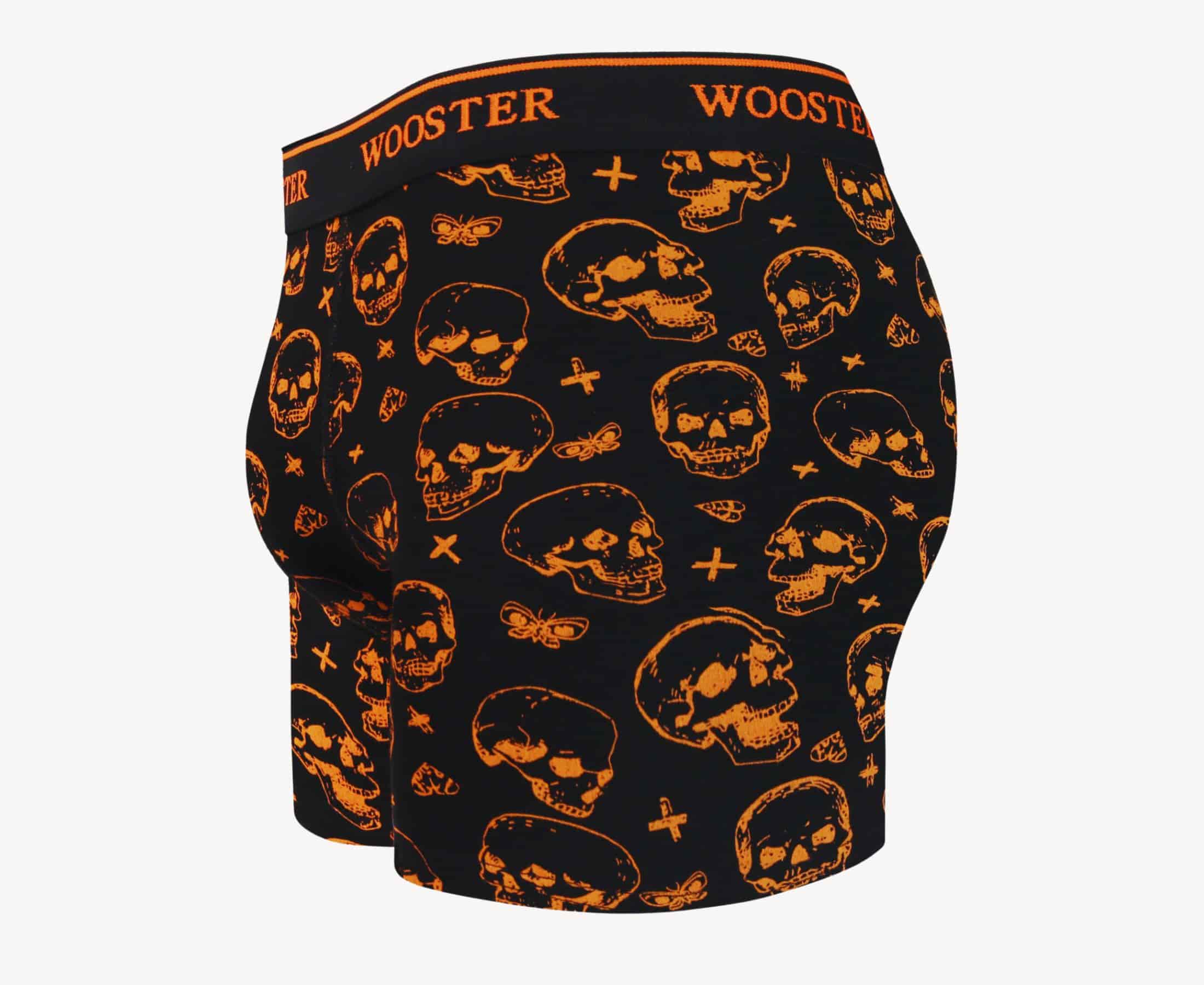 Side view of men’s 95% cotton black boxer brief with orange skulls print showing contoured pouch and relaxed fit