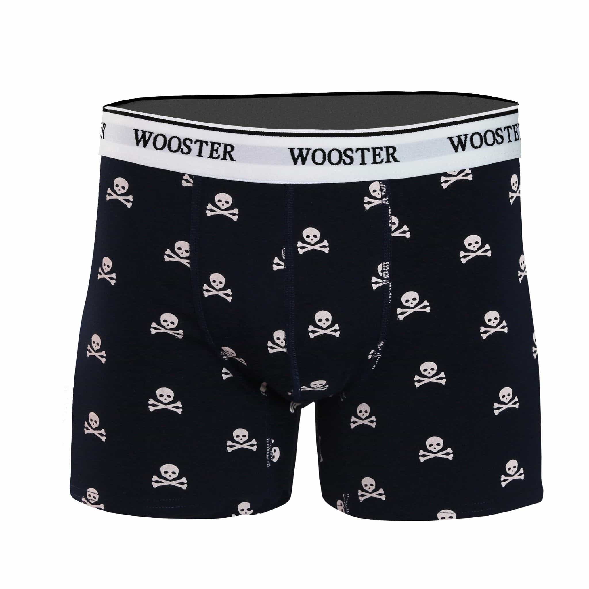 Front view of men’s 95% cotton navy boxer brief with light pink skull and bones print, relaxed fit, soft stretch cotton, and no-roll waistband
