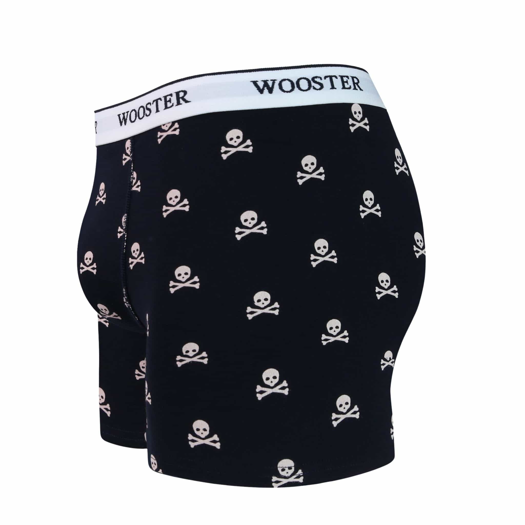 Side view of men’s 95% cotton navy boxer brief with light pink skull and bones print showing contoured pouch and relaxed fit