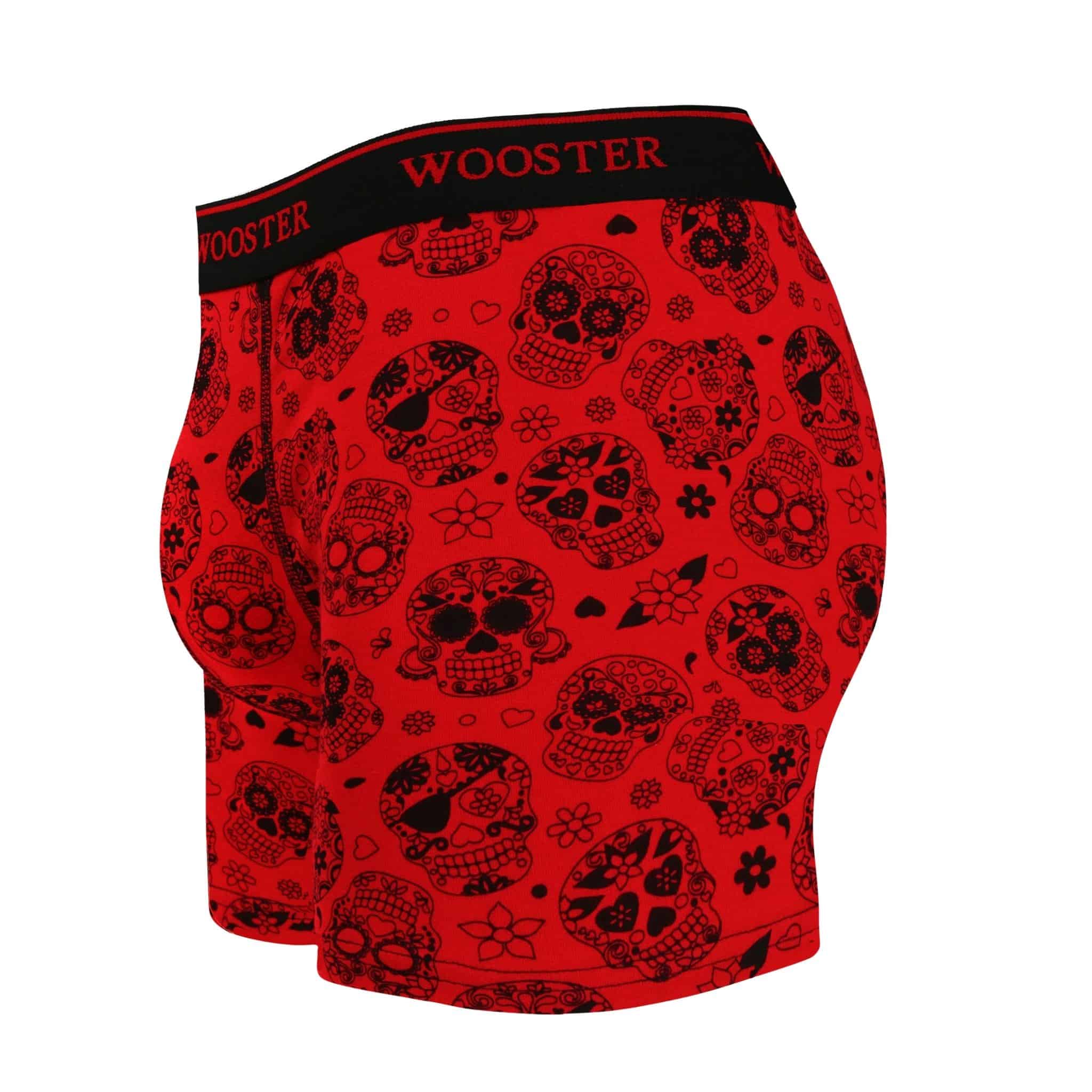 Side view of men’s 95% cotton crimson red boxer brief with black skulls in bloom print showing contoured pouch and relaxed fit