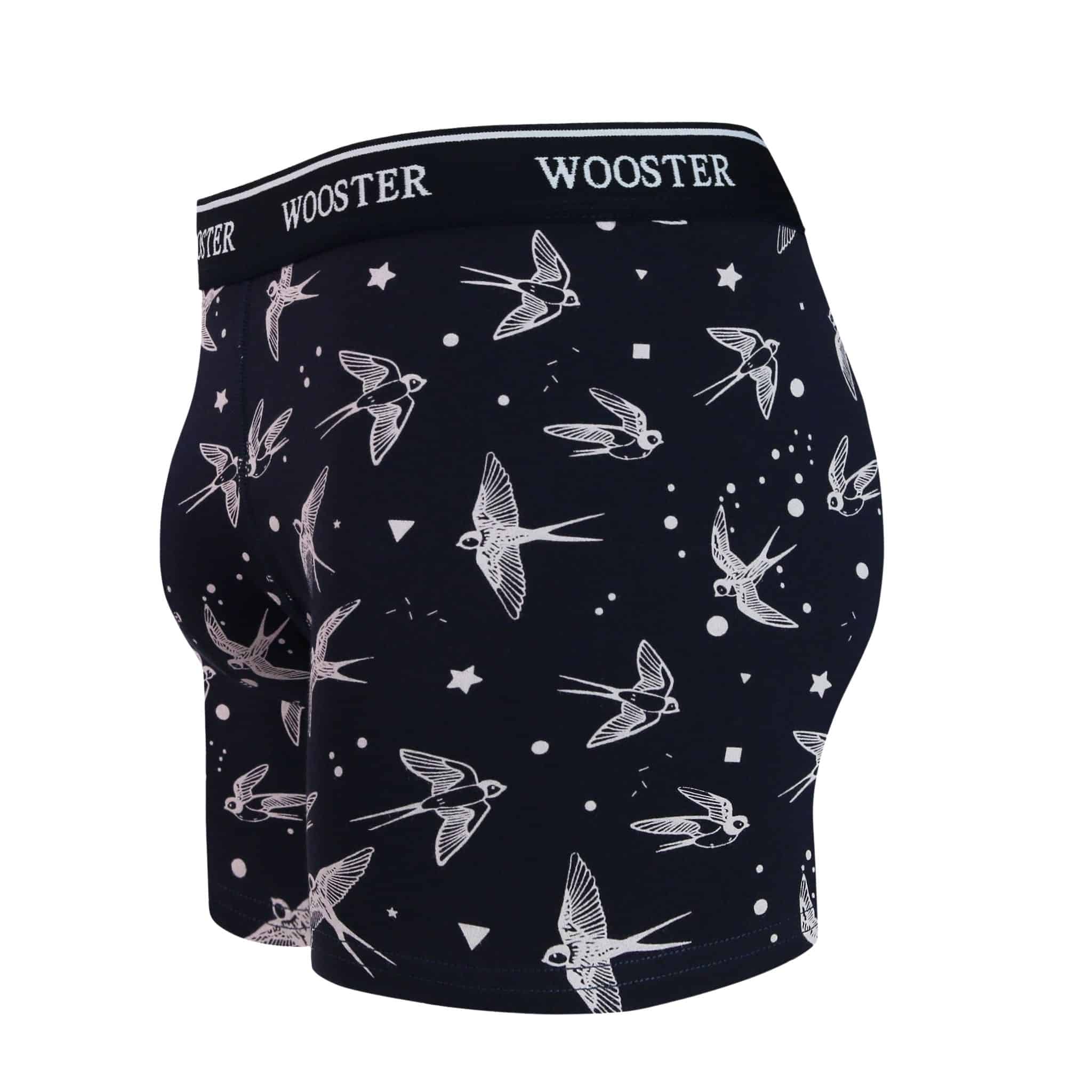 Side view of men’s 95% cotton navy boxer brief with light pink starling birds, stars, and moon print showing contoured pouch and relaxed fit