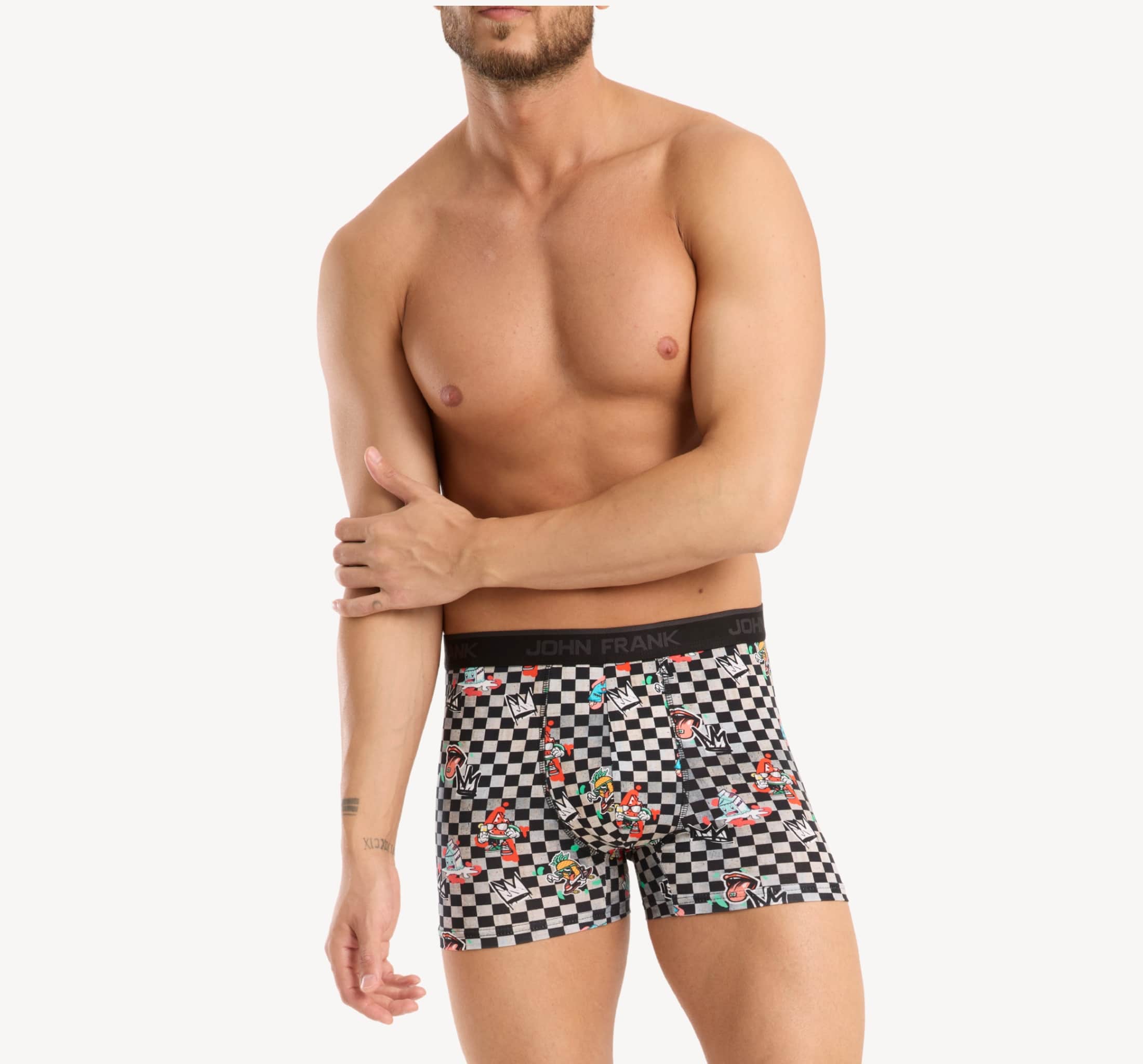 Front view of model wearing men’s 95% cotton boxer brief in checkered surrealist print with smooth waistband and soft stretch fit