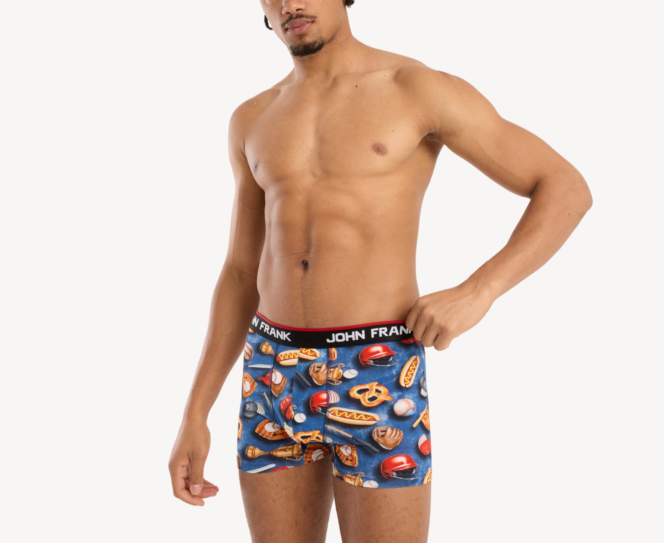 Side view of model wearing men’s 95% cotton boxer brief in multicolor baseball-inspired print with contoured pouch and tailored leg cut