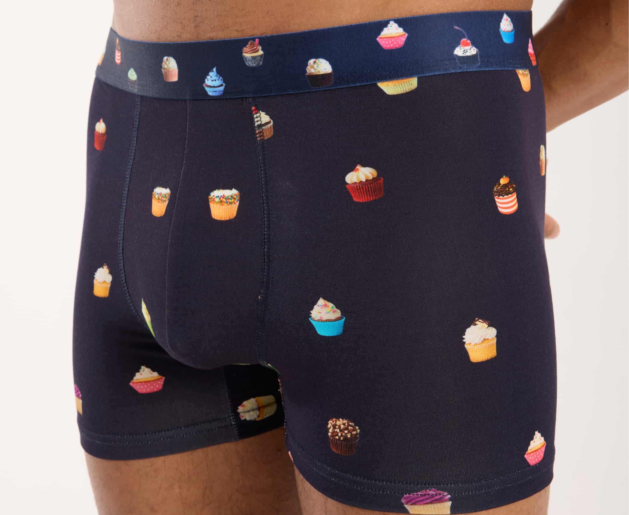 Close-up view of men’s 95% micromodal boxer brief in navy with cupcake print, showcasing fabric covered waistband and print detail