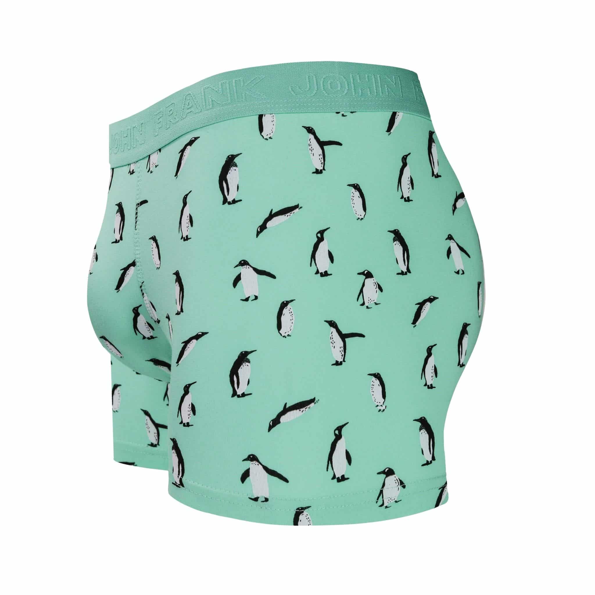 Side view of men’s 95% cotton boxer brief in turquoise with penguin print, contoured pouch, and tailored leg cut