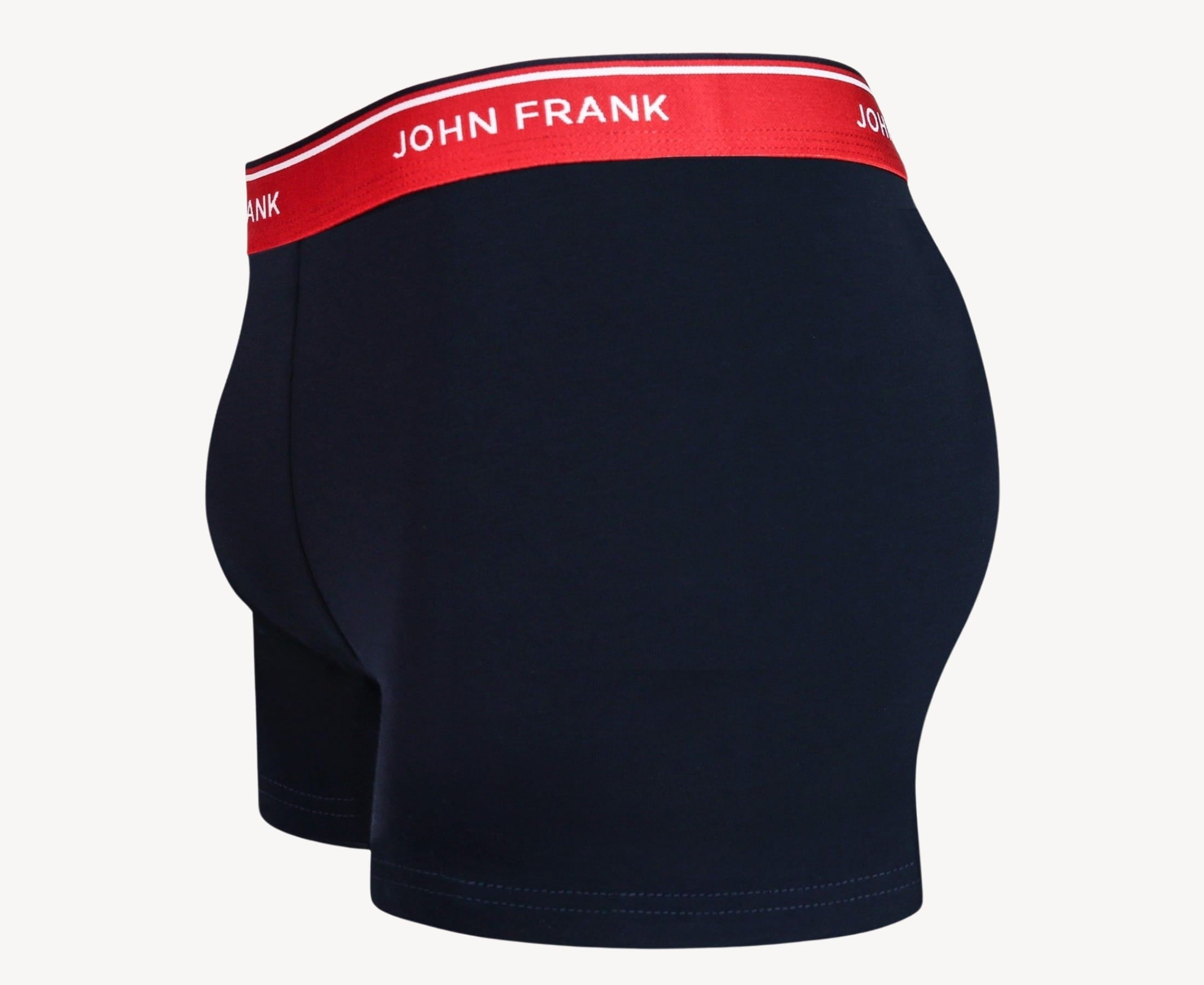 Side view of men’s 95% cotton boxer brief in midnight blue with cherry red striped waistband, contoured pouch, and tailored leg cut