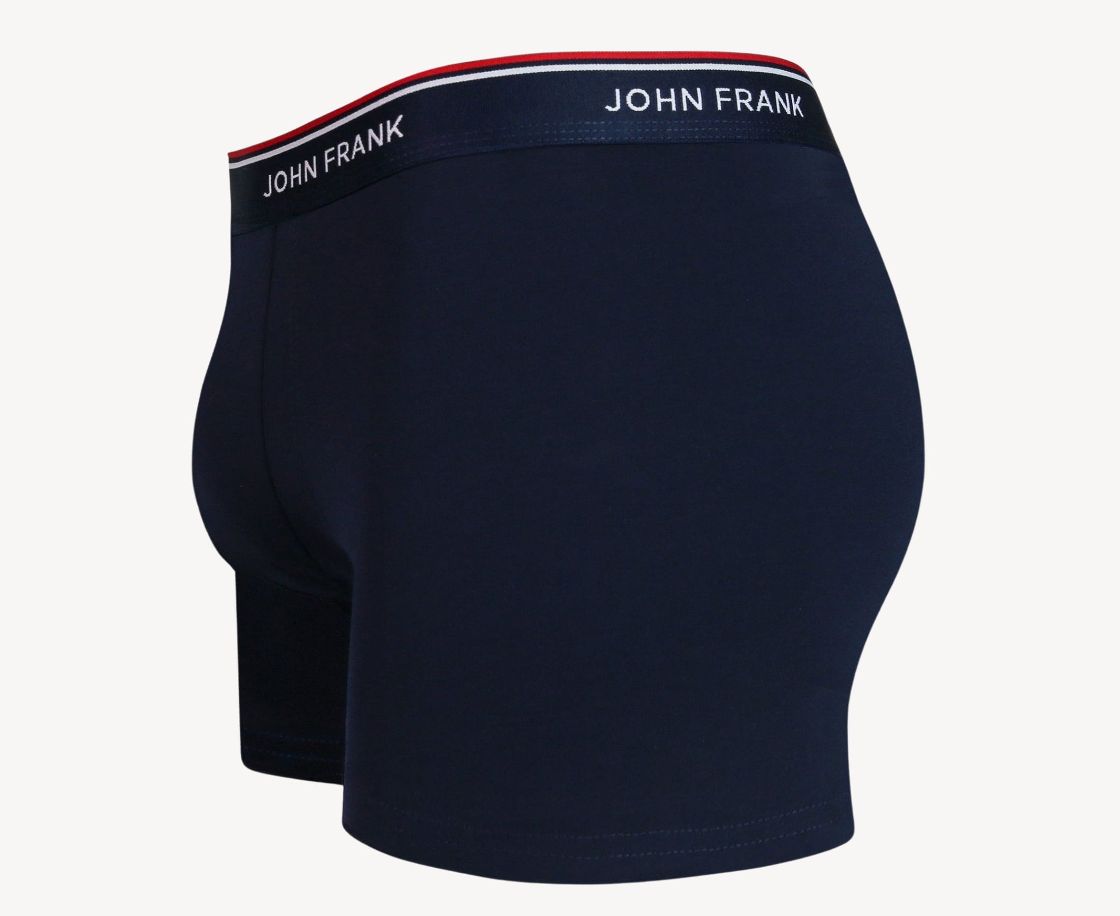 Side view of men’s 95% cotton boxer brief in midnight blue with midnight blue striped waistband, contoured pouch, and tailored leg cut