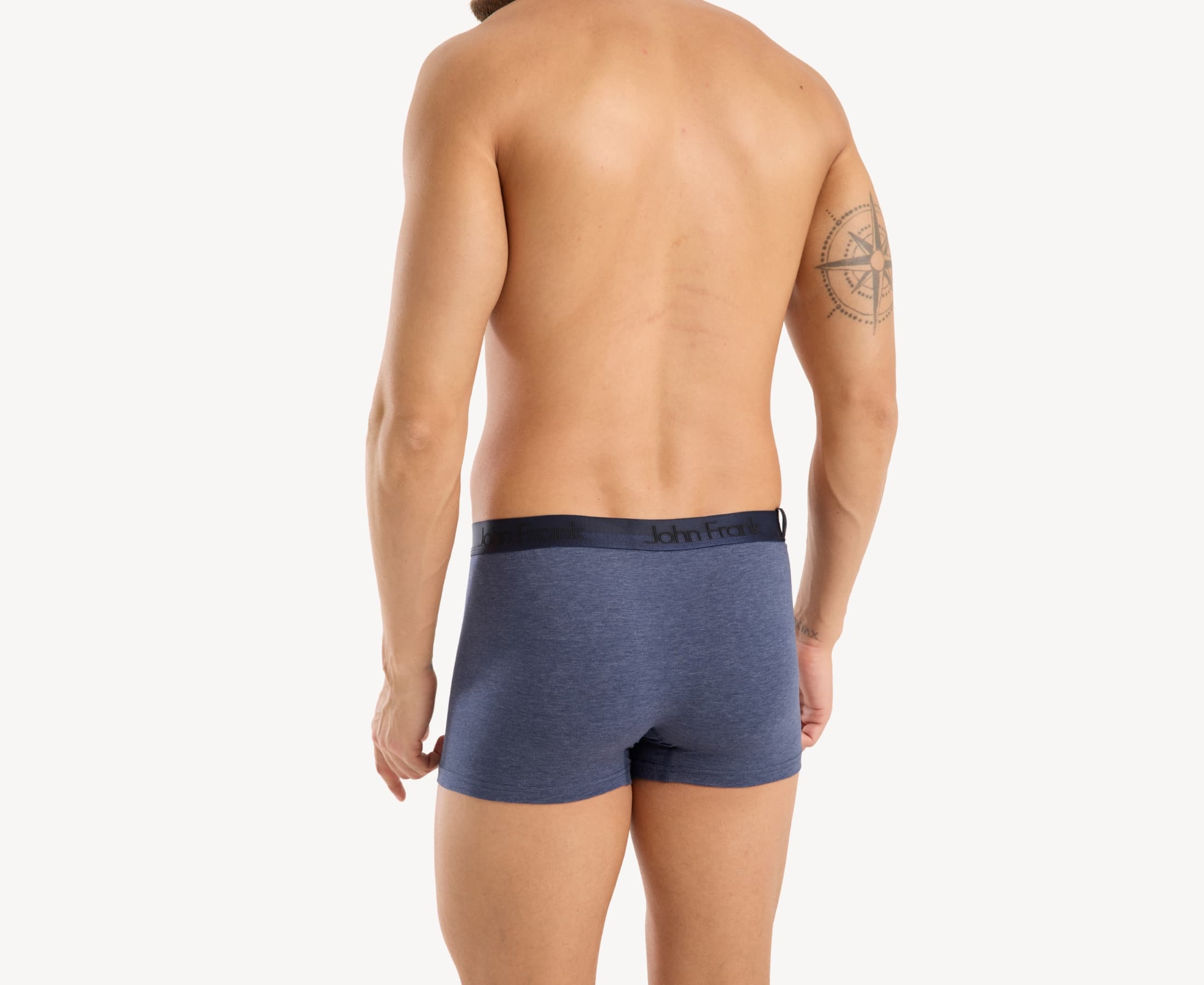 Back view of model wearing men’s 95% cotton boxer brief in slate blue with dark blue shiny waistband and rear detail
