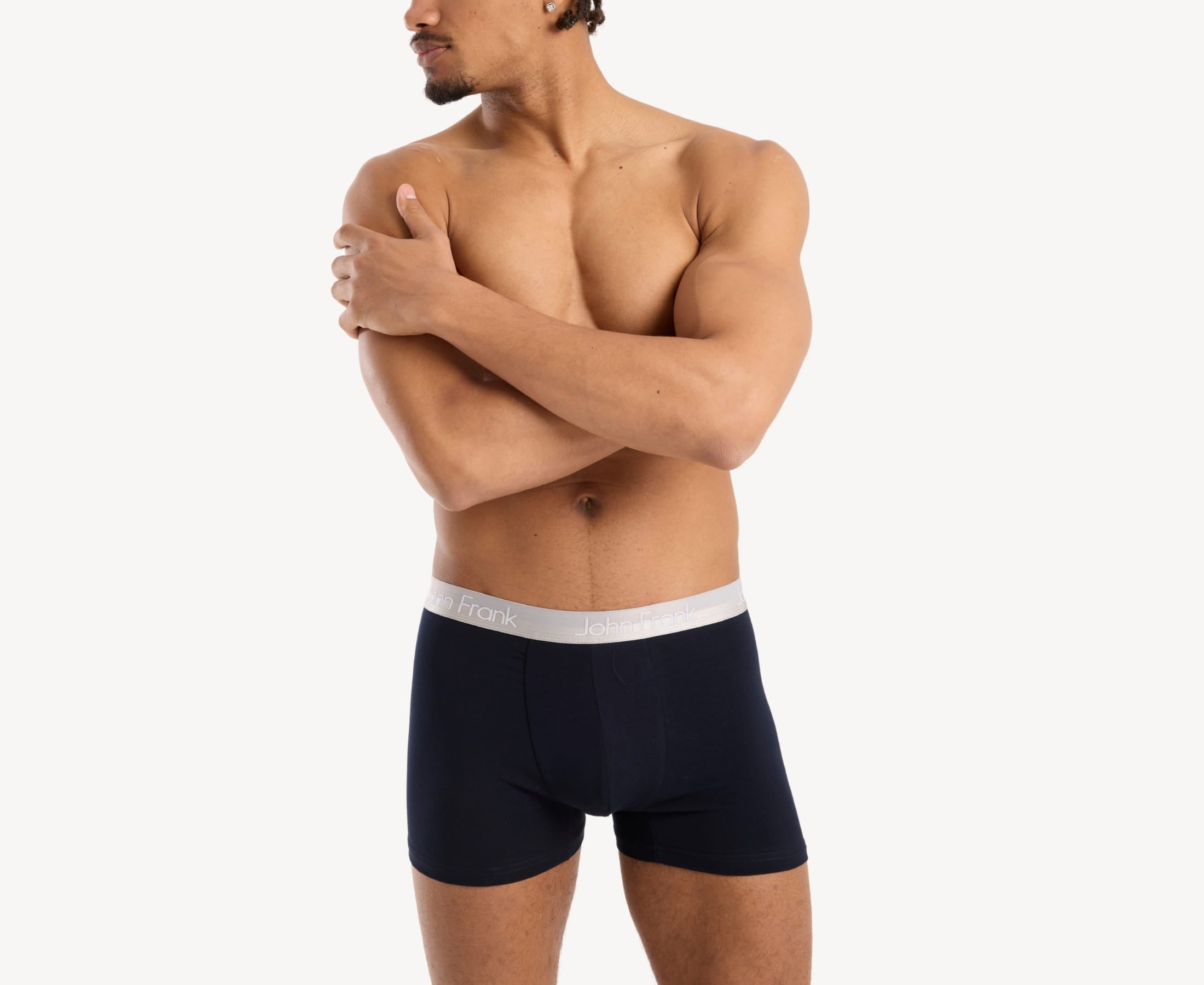 Front view of model wearing men’s 95% cotton boxer brief in navy with white shiny waistband, invisible seams and soft stretch