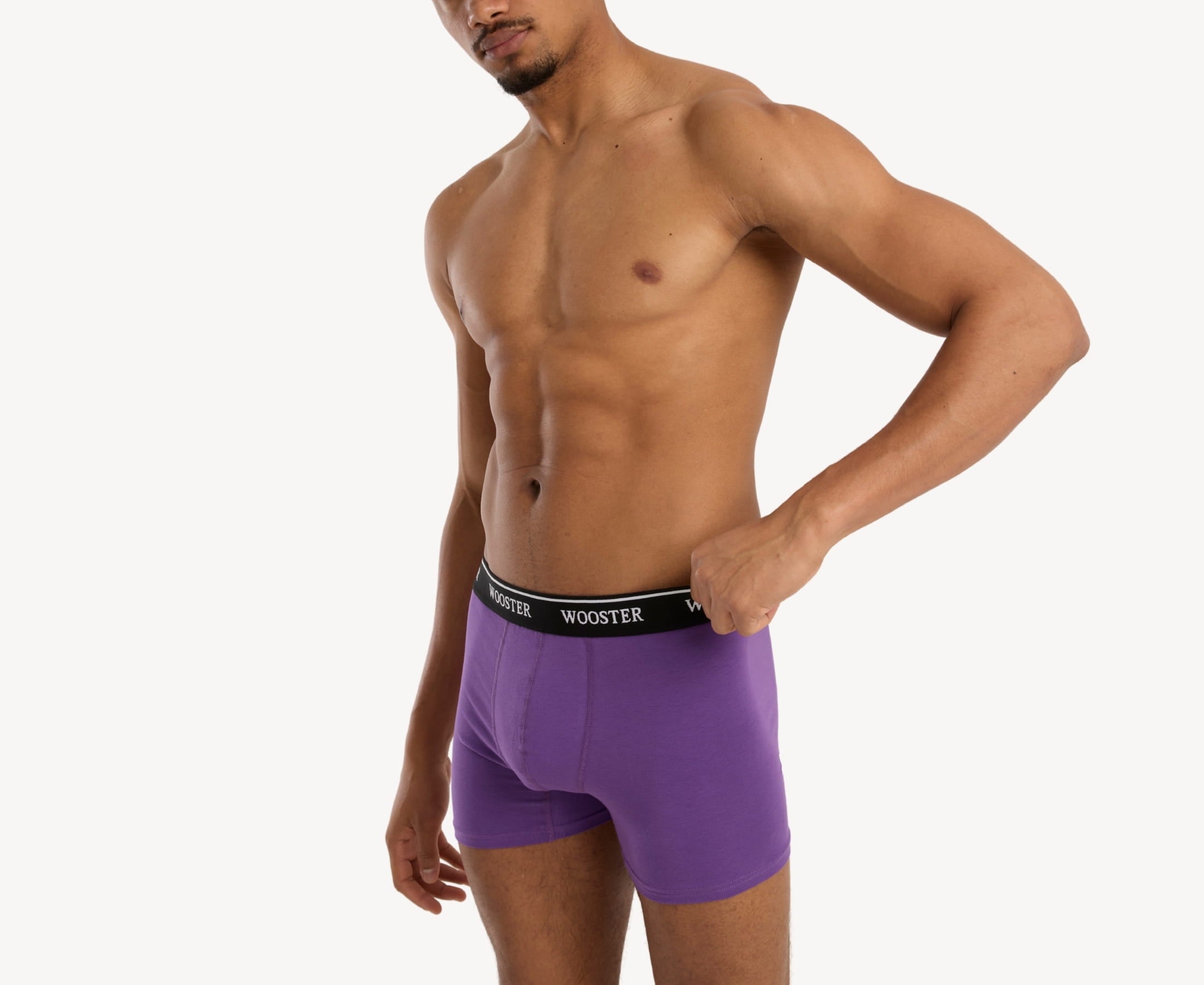 Side view of model wearing men’s 95% cotton boxer brief in mulberry showing contoured pouch and relaxed fit