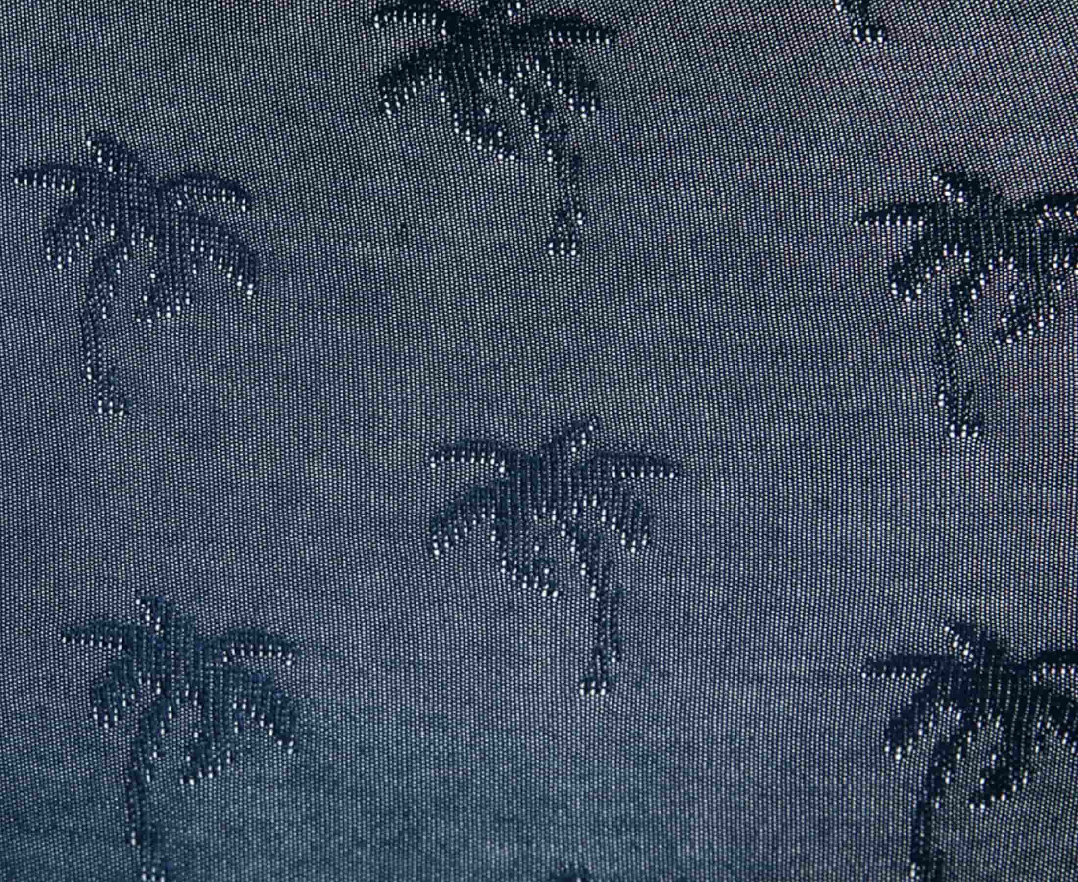 Detailed view of navy fabric with jacquard palms pattern