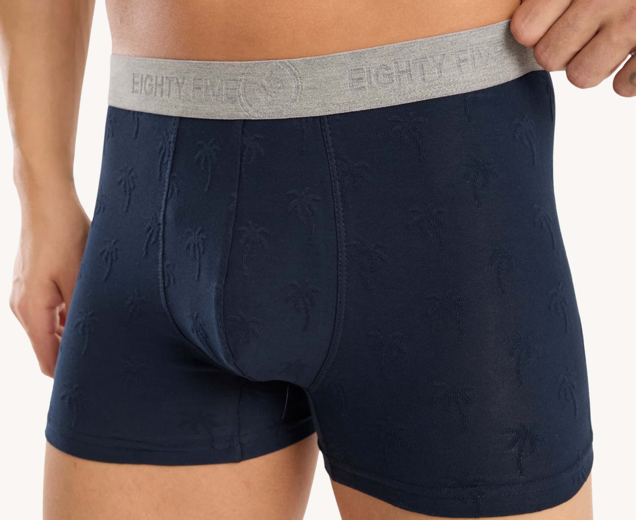 Close-up view of men’s 95% cotton boxer brief in navy with jacquard palms pattern, showcasing the pattern and smooth no-roll waistband