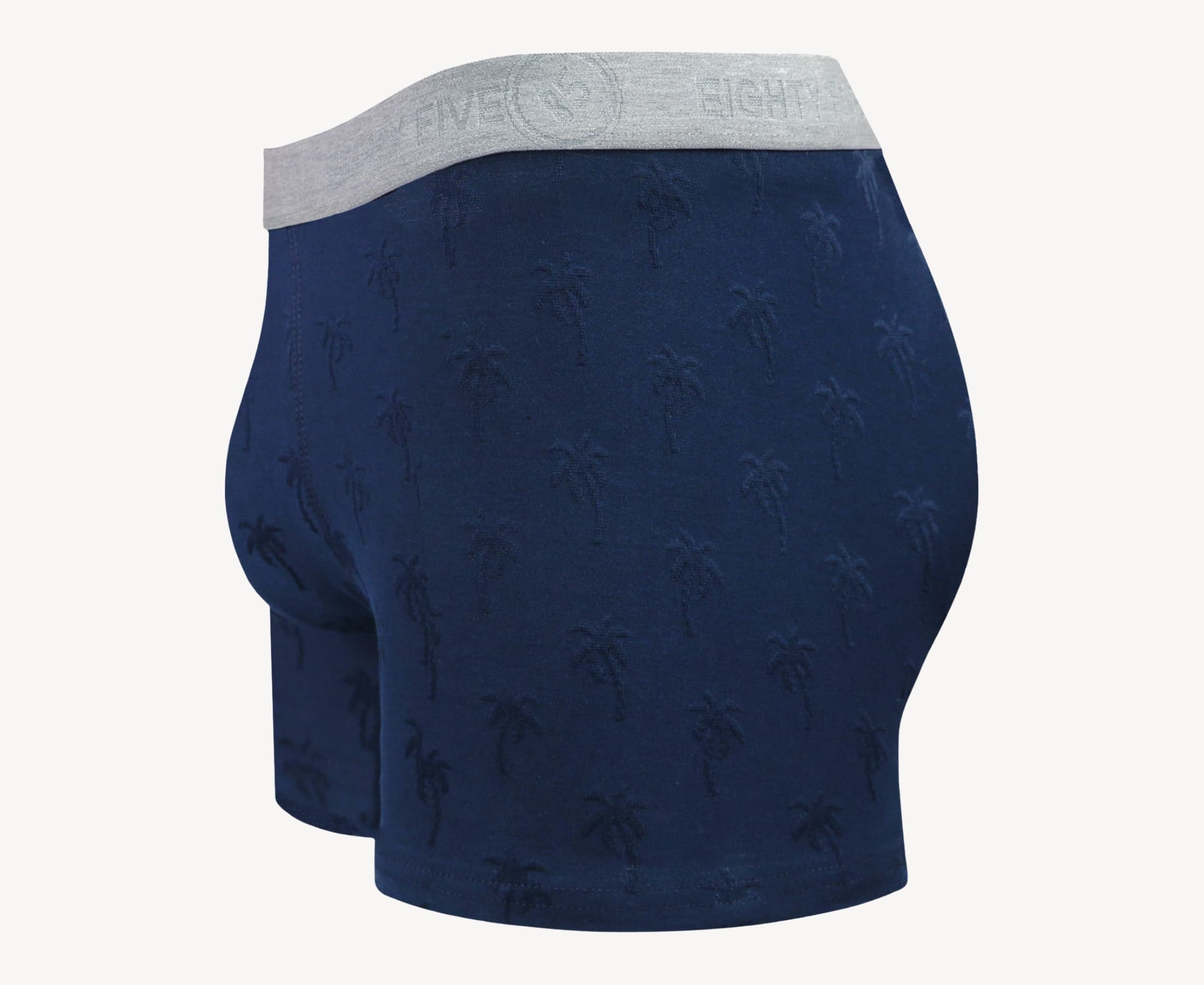 Side view of men’s 95% cotton boxer brief in navy with jacquard palms pattern, showcasing contoured pouch, and tailored leg cut