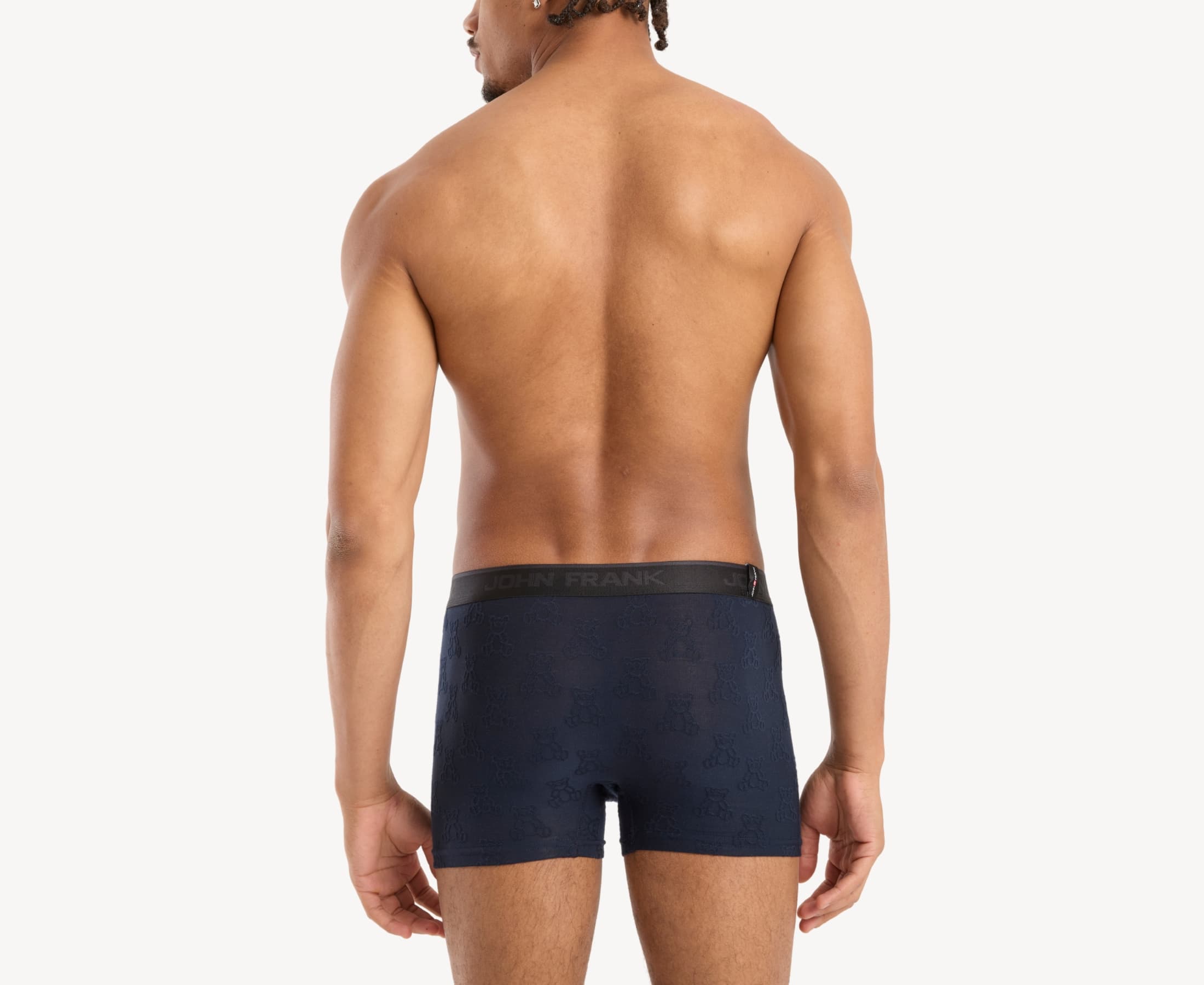 Back view of model wearing men’s 95% micromodal boxer brief in navy with jacquard teddy bears pattern, showcasing smooth waistband and rear detail