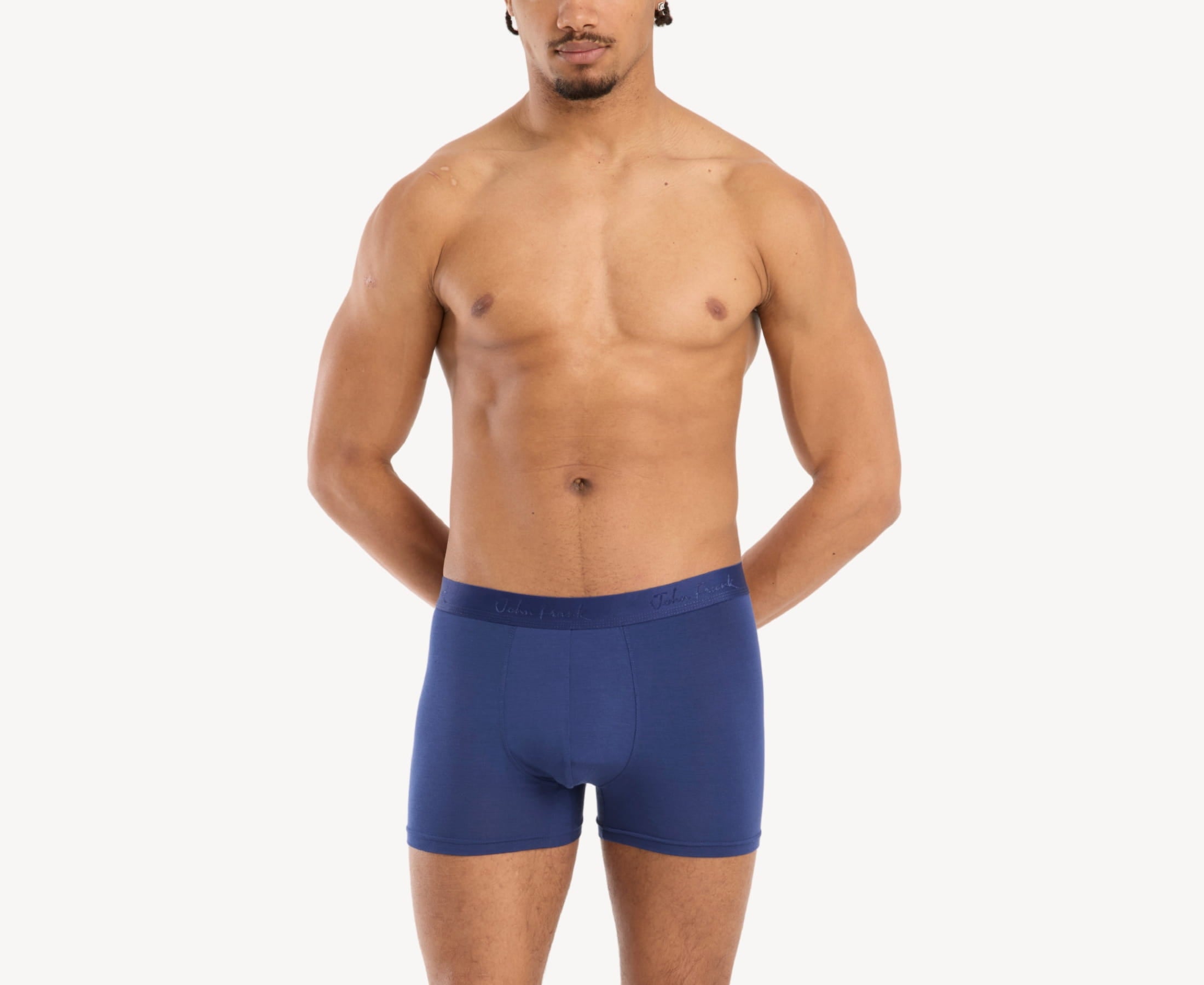 Front view of model wearing men’s 95% micromodal boxer brief in royal blue with tonal waistband featuring subtle sheen, and soft stretch