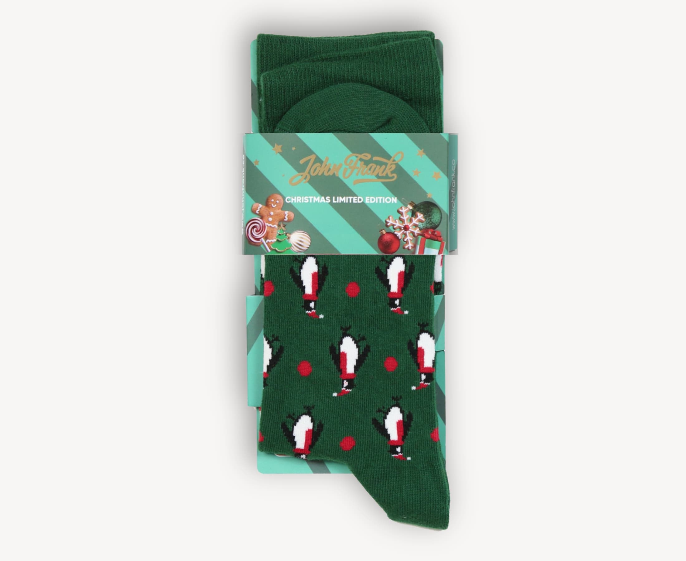 Packaged view of men’s 80% cotton crew socks in deep green with penguin and scarf print, folded neatly with holiday-themed belly band