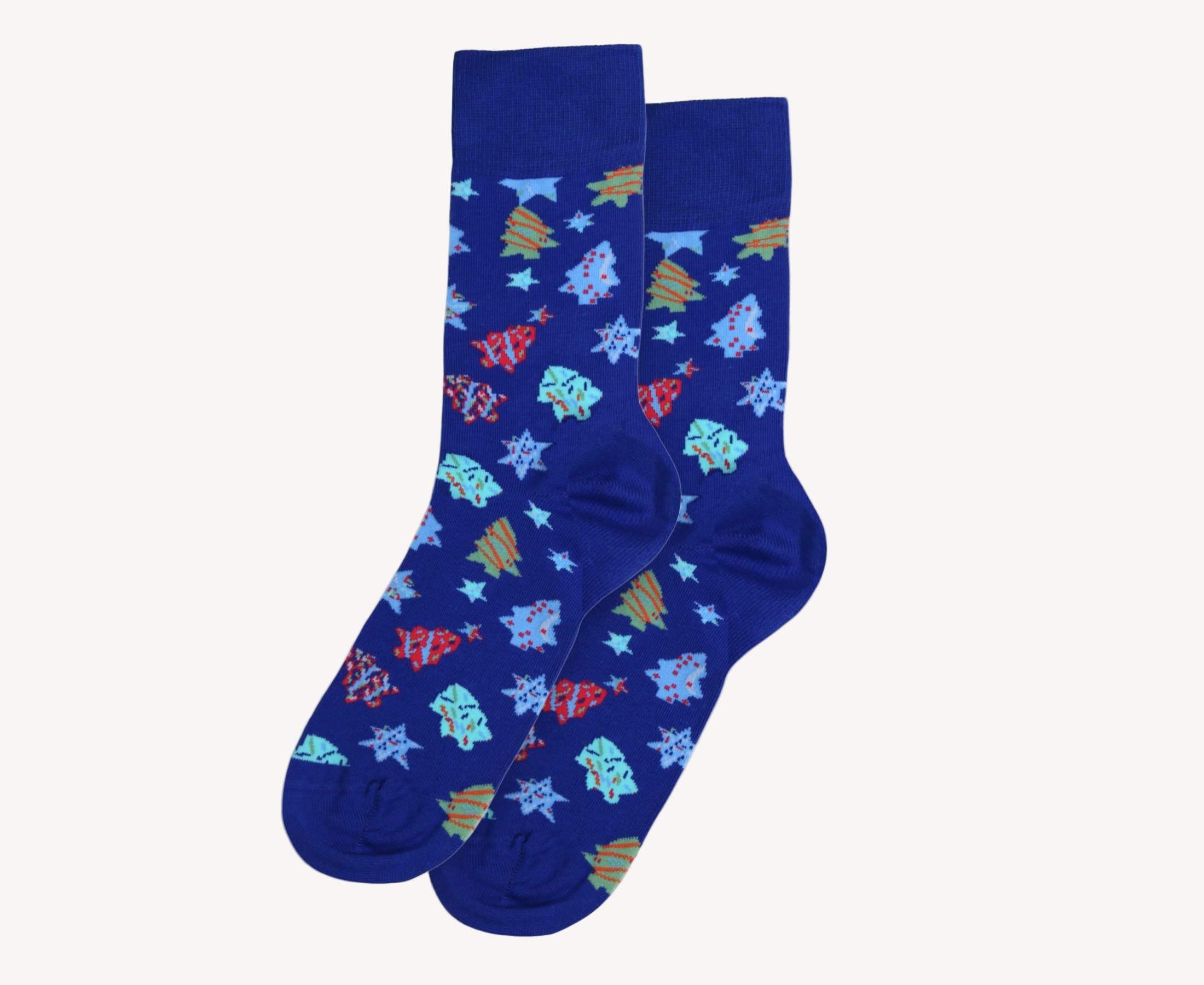 Flat lay of men’s 80% cotton crew socks in  blue with colorful sugar cookie print featuring stars, trees, and wrapped gifts, soft knit with smooth seams and festive details