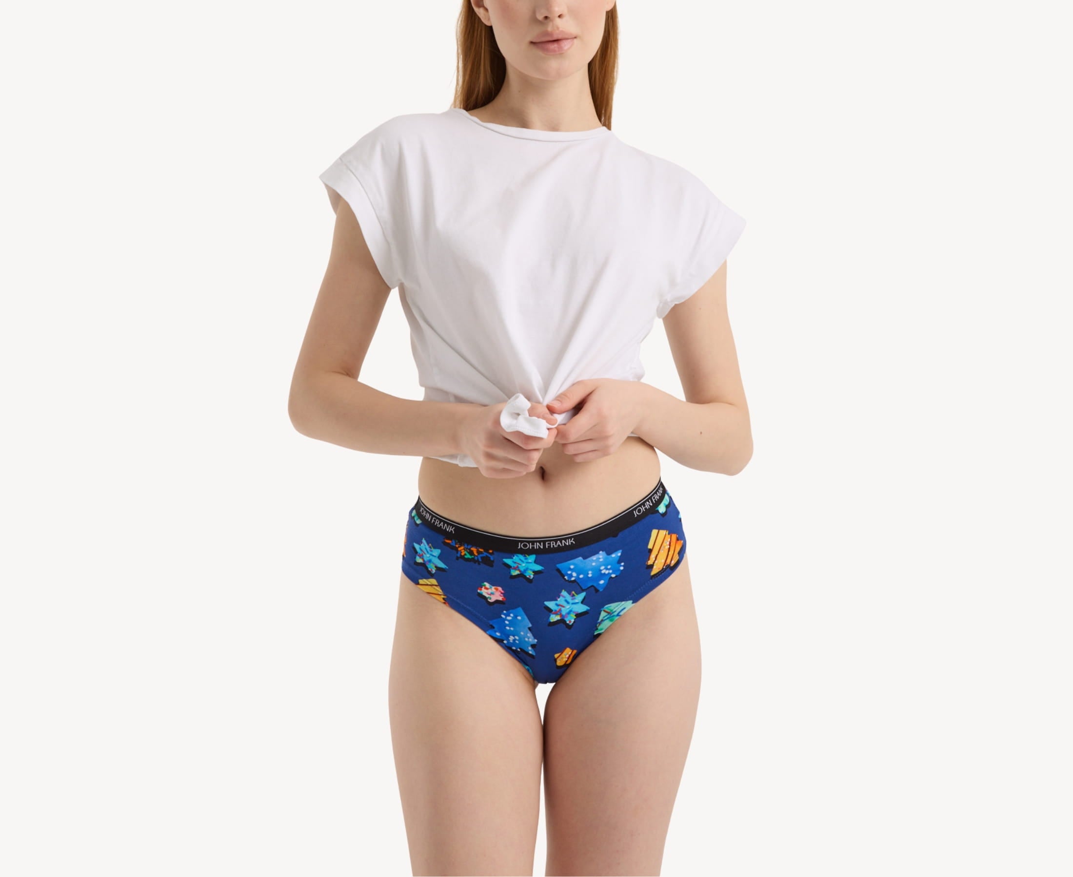 Front view of model wearing women’s 95% premium cotton hipster in royal blue with colorful sugar cookies print, showcasing mid-rise cut and smooth waistband.
